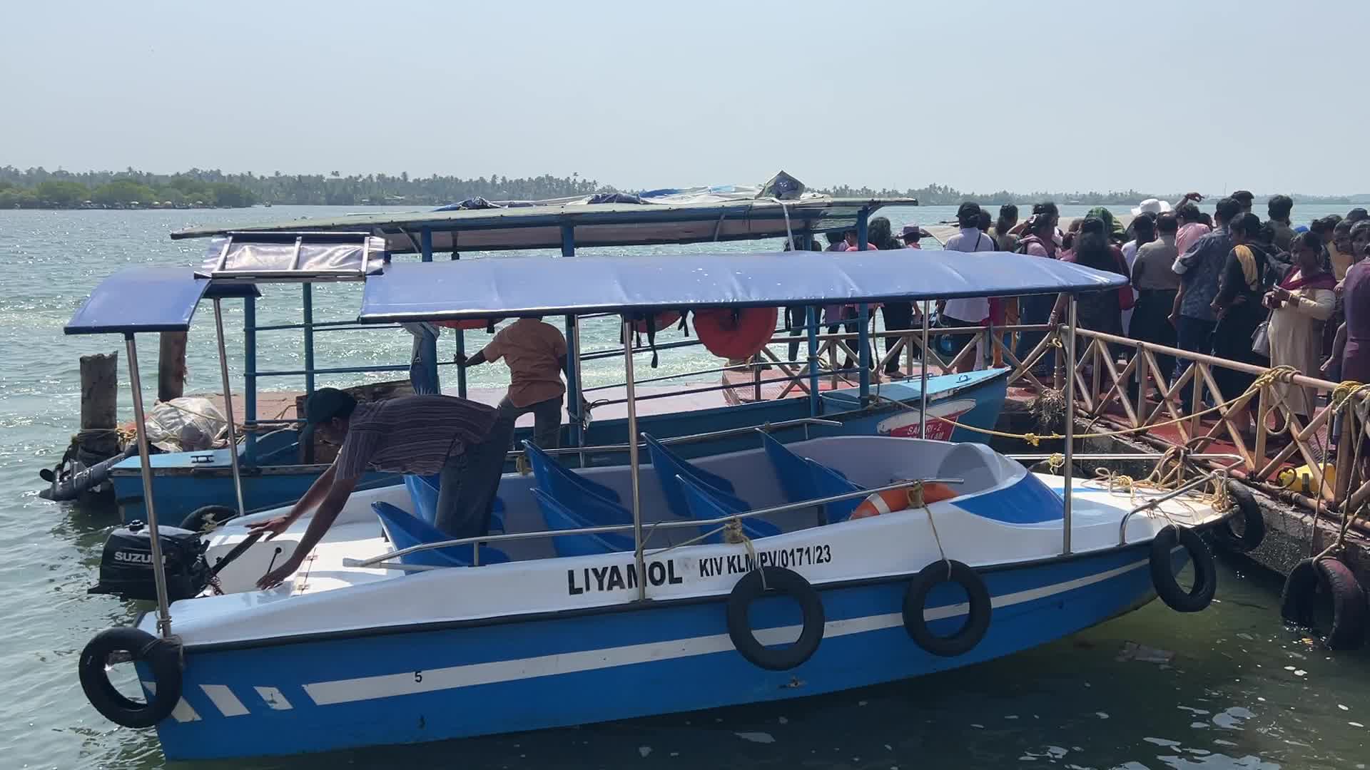 Indian tourists board boats to travel to Sambranikodi Island 