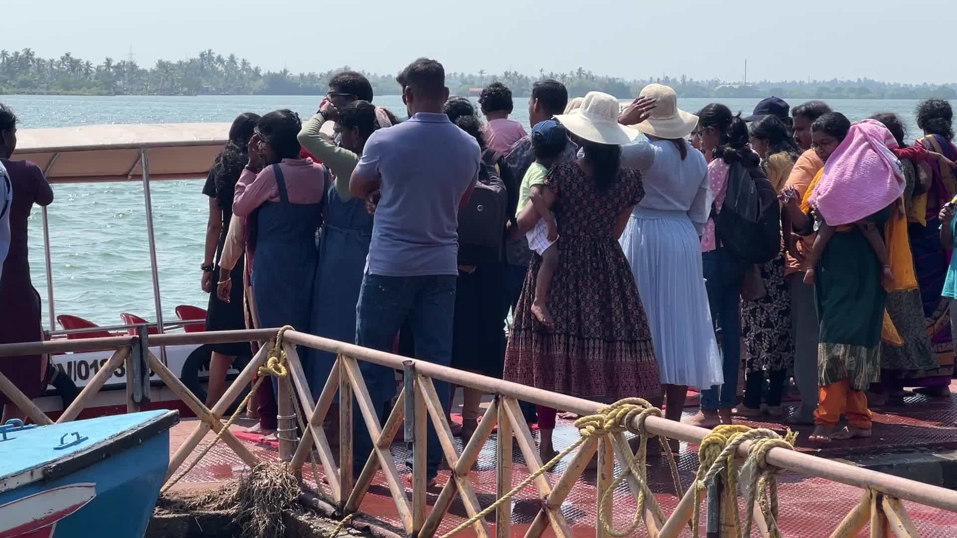 Indian tourists board boats to travel to Sambranikodi Island 