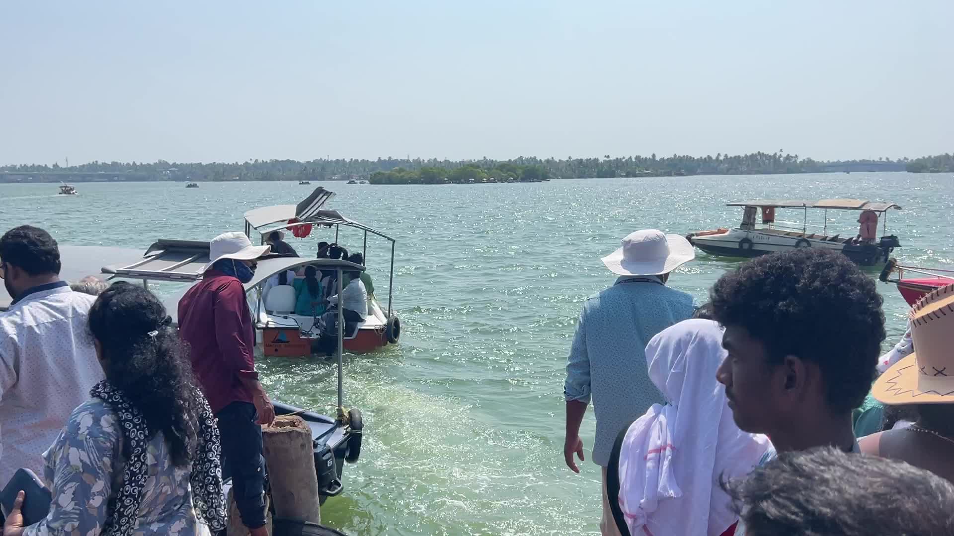 Indian tourists board boats to travel to Sambranikodi Island 