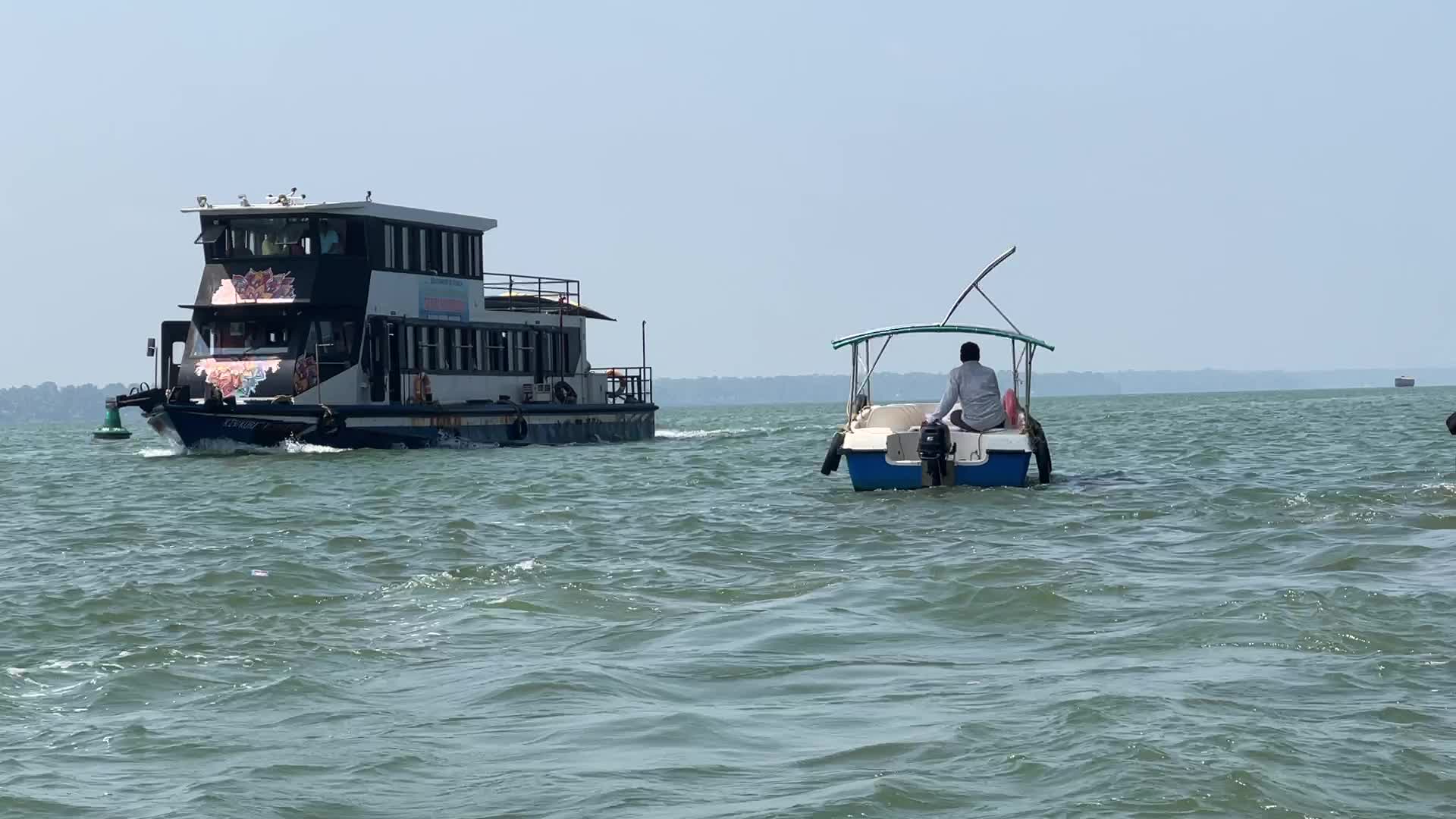 Indian tourists board boats to travel to Sambranikodi Island 