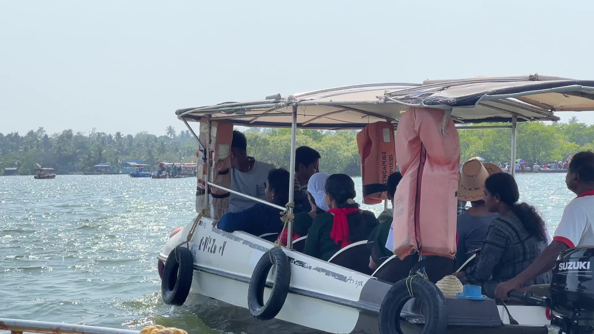 Indian tourists board boats to travel to Sambranikodi Island 