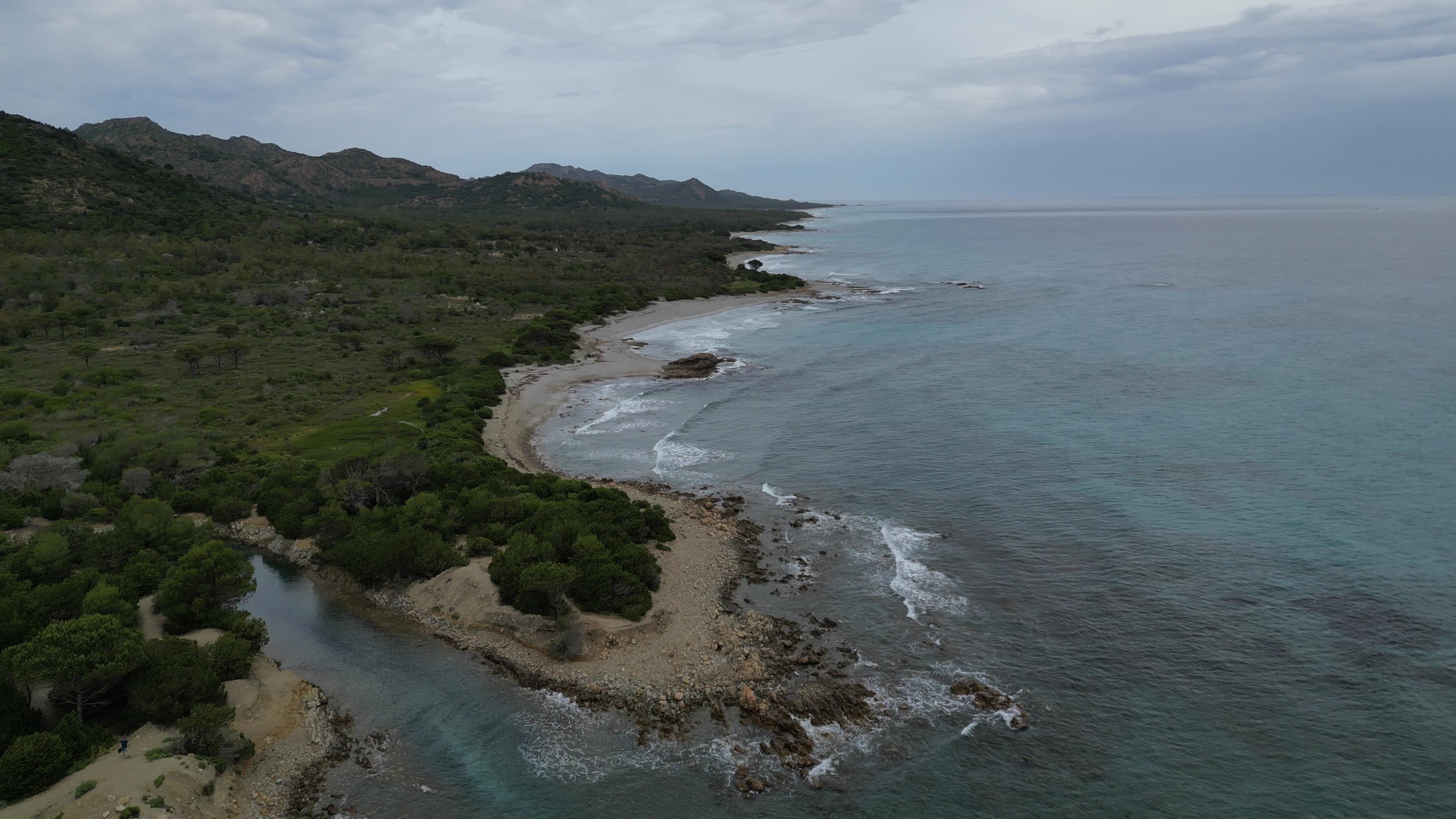 Drone view of Berchida Beach and the protected area surrounding it