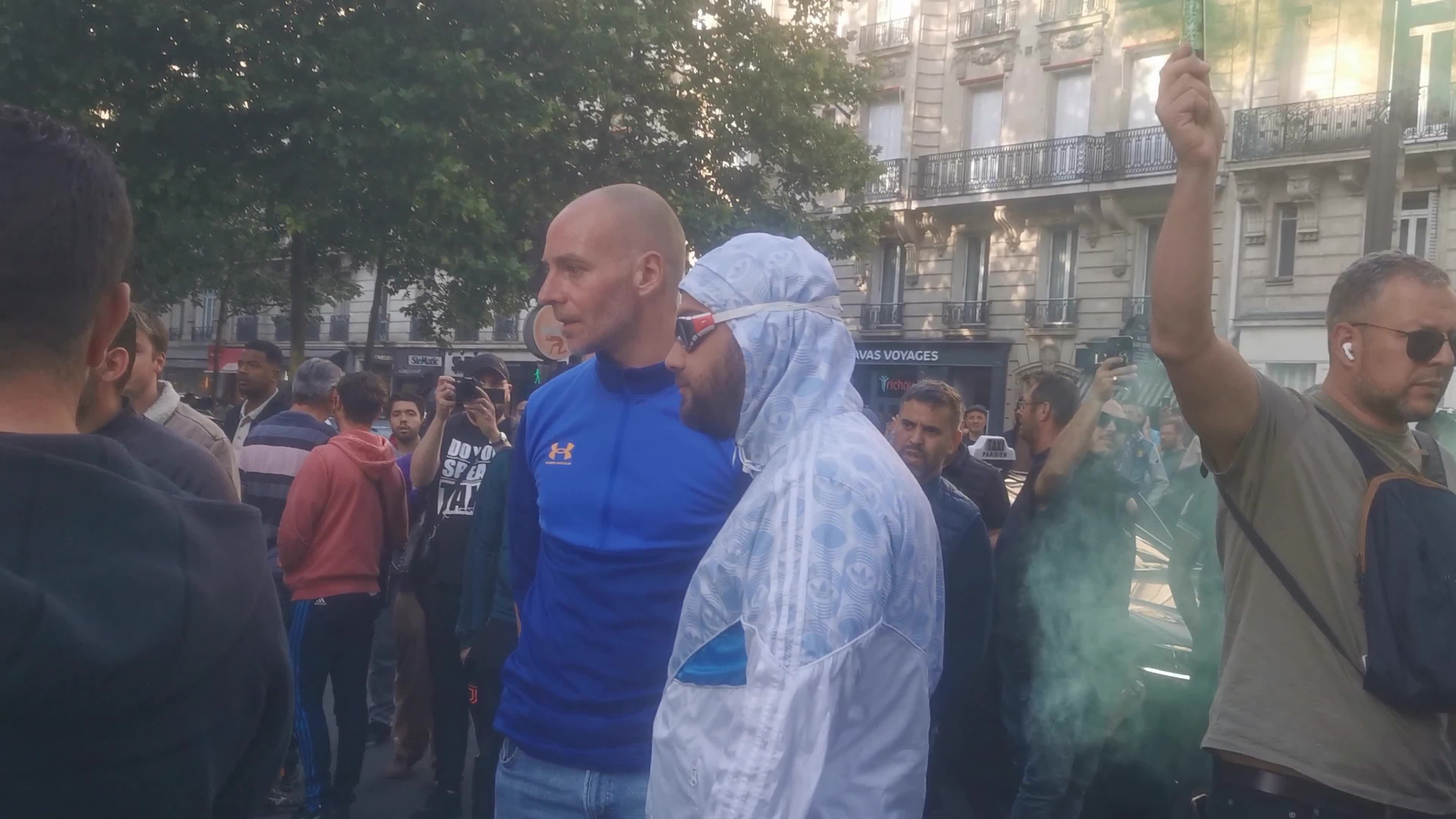 Hundreds of French taxi drivers gather in the street of Paris and block the Avenue Raspail near the Ministry of Transport