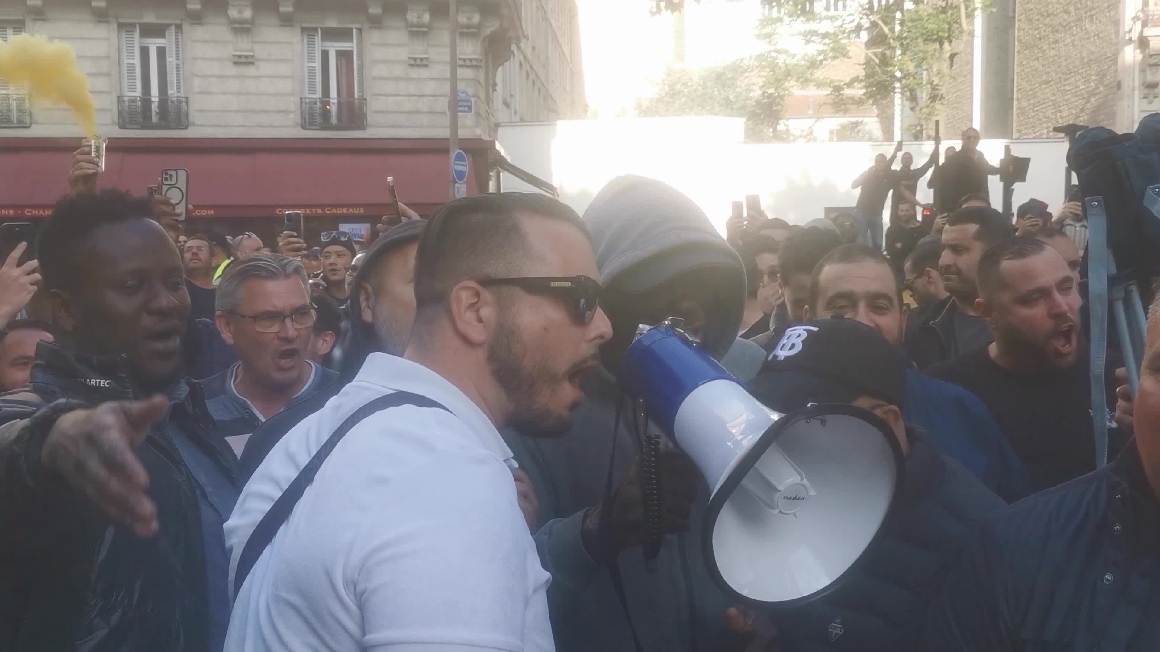 Hundreds of French taxi drivers gather in the street of Paris and block the Avenue Raspail near the Ministry of Transport
