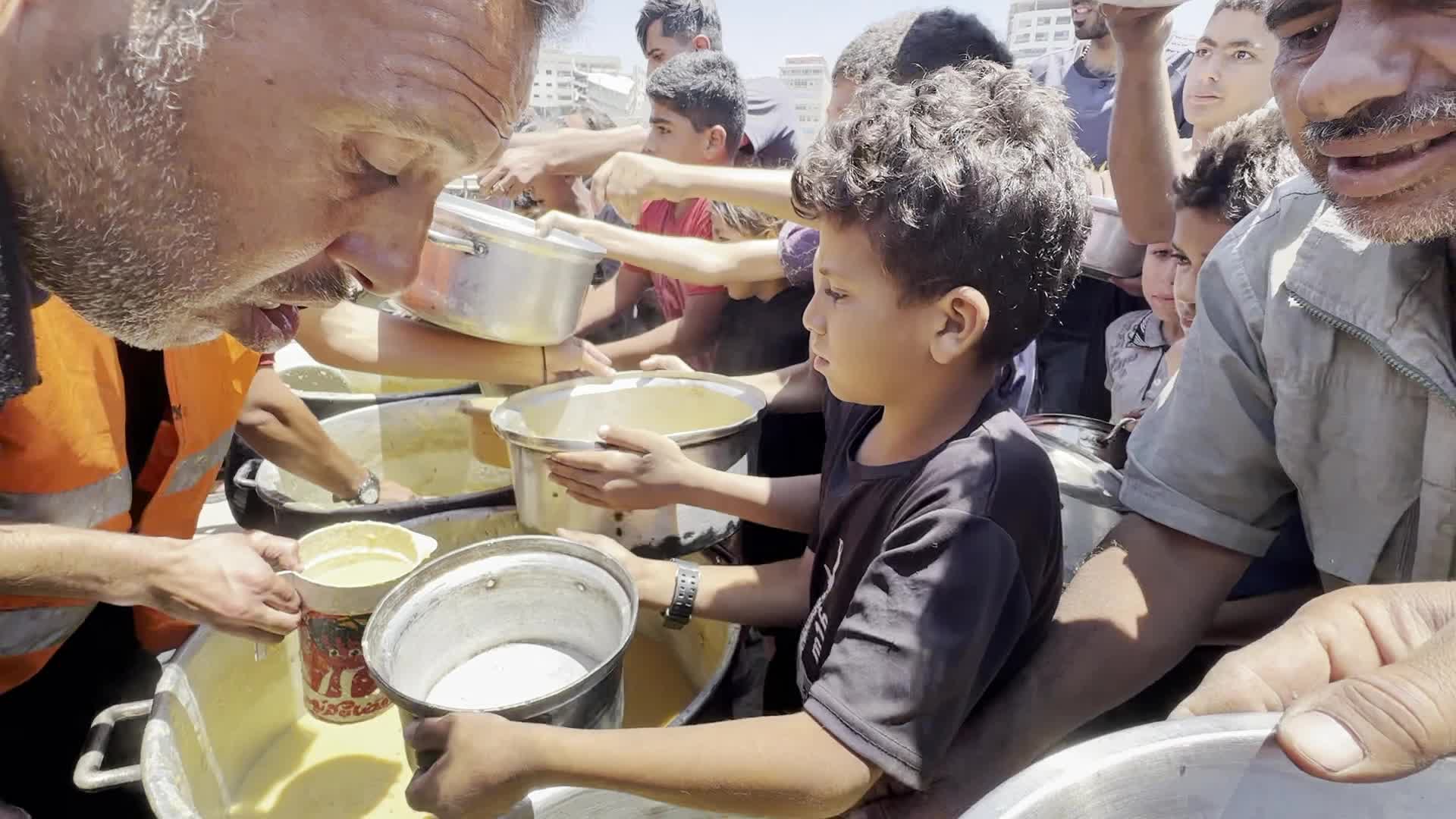 Palestinians Line Up for Hot Meals at Distribution Point in Gaza City