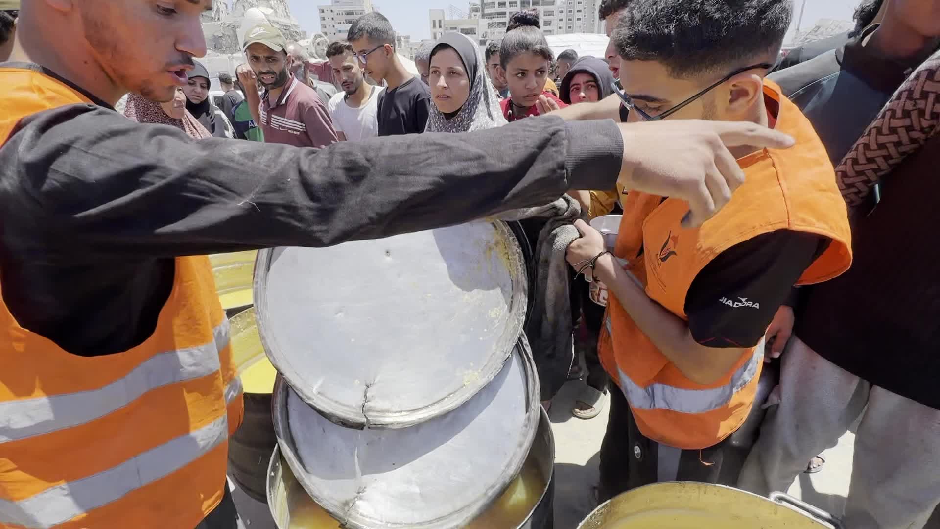 Palestinians Line Up for Hot Meals at Distribution Point in Gaza City