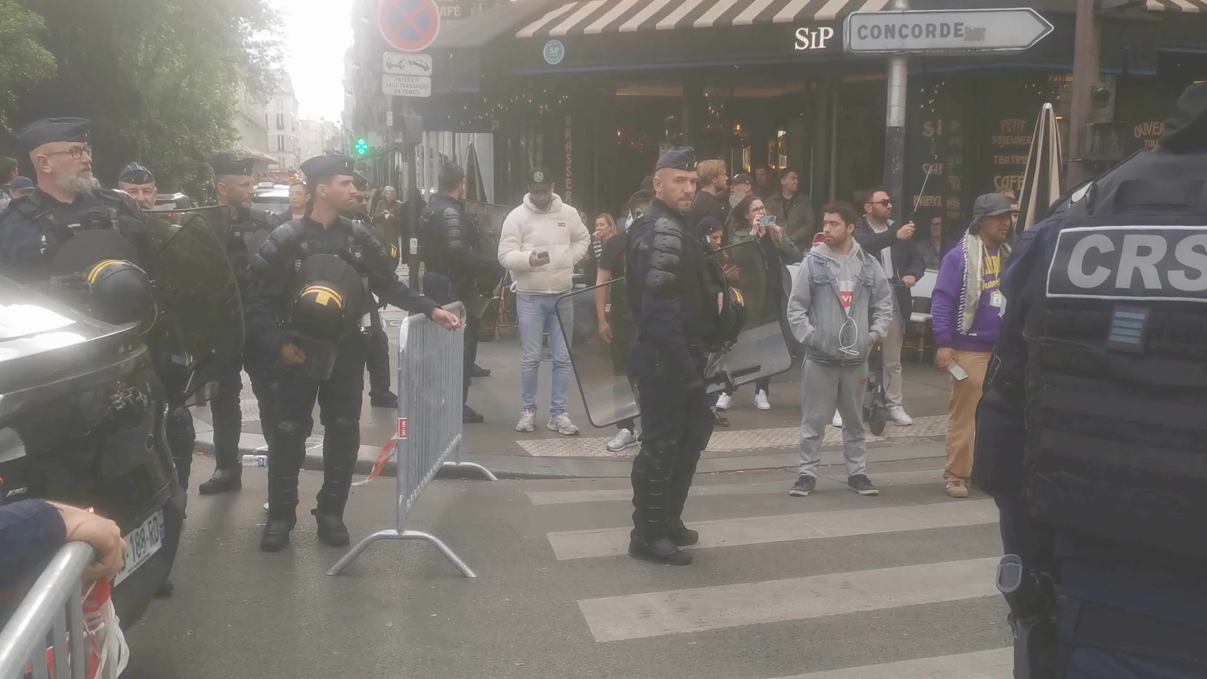 Hundreds of French taxi drivers gather in the street of Paris and block the Avenue Raspail near the Ministry of Transport