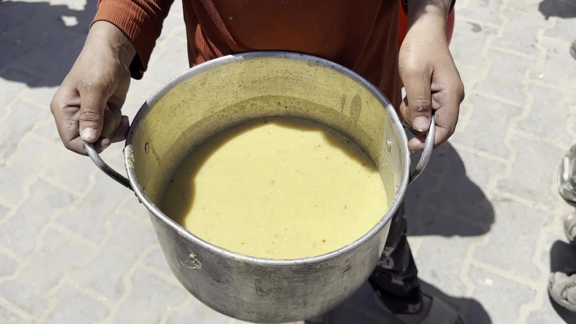 Palestinians Line Up for Hot Meals at Distribution Point in Gaza City