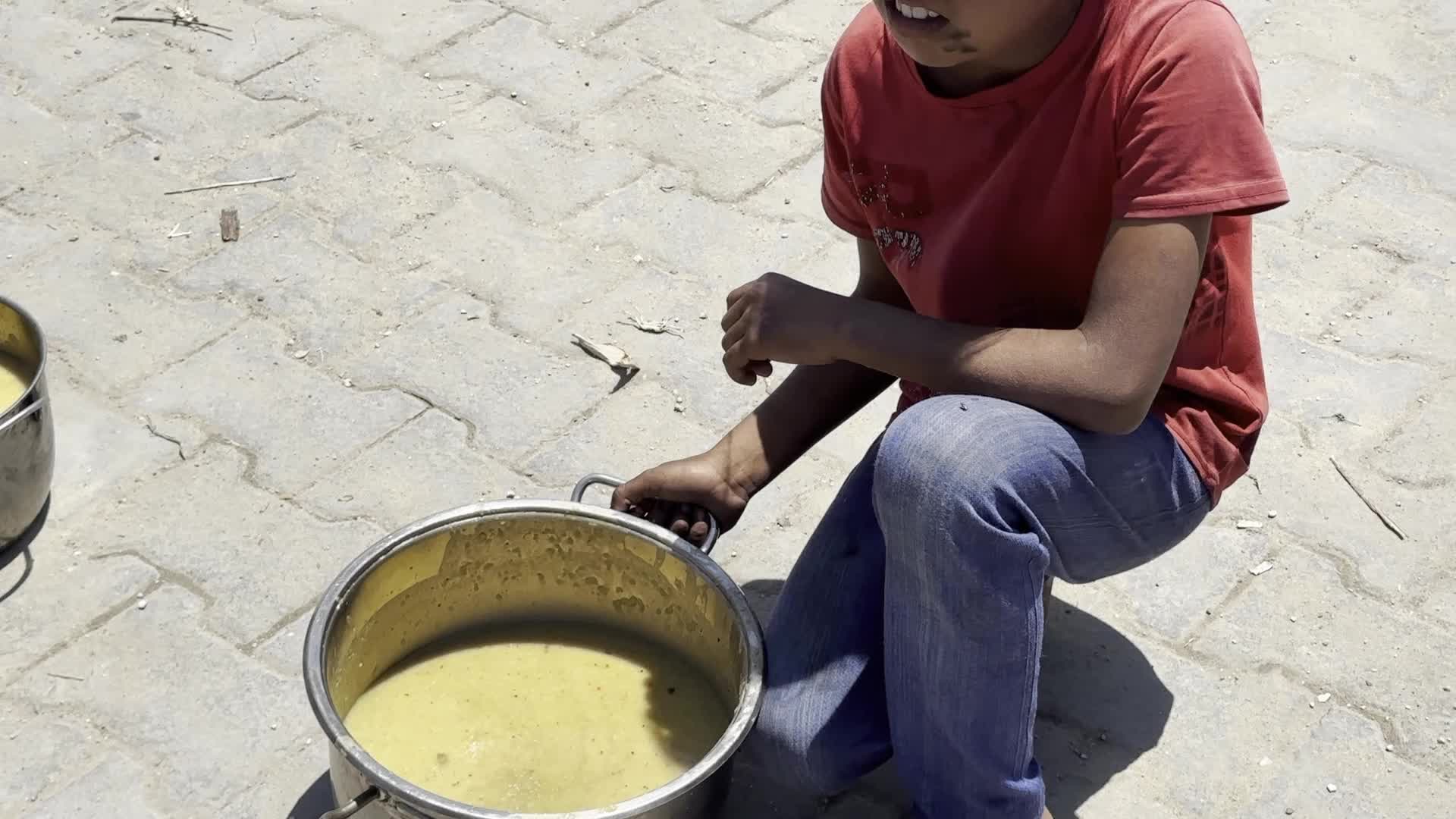 Palestinians Line Up for Hot Meals at Distribution Point in Gaza City