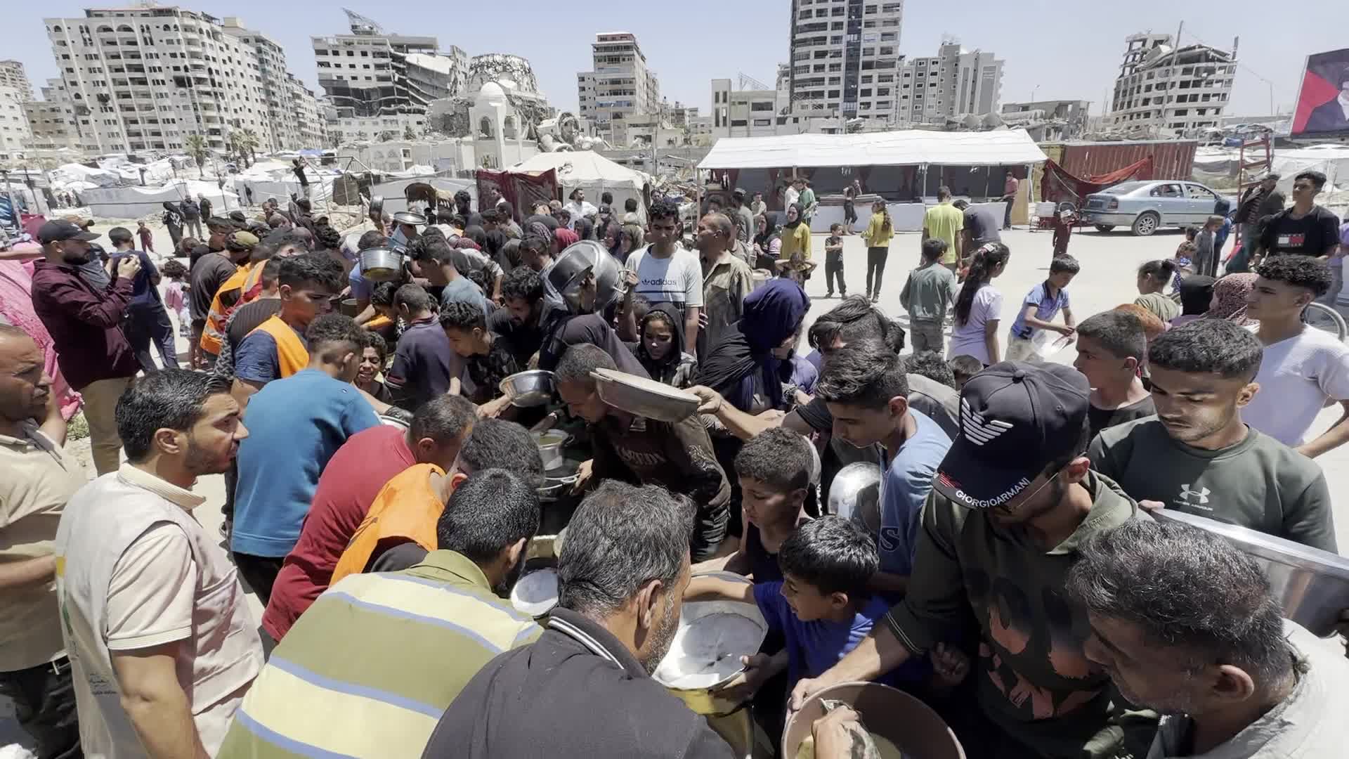 Palestinians Line Up for Hot Meals at Distribution Point in Gaza City
