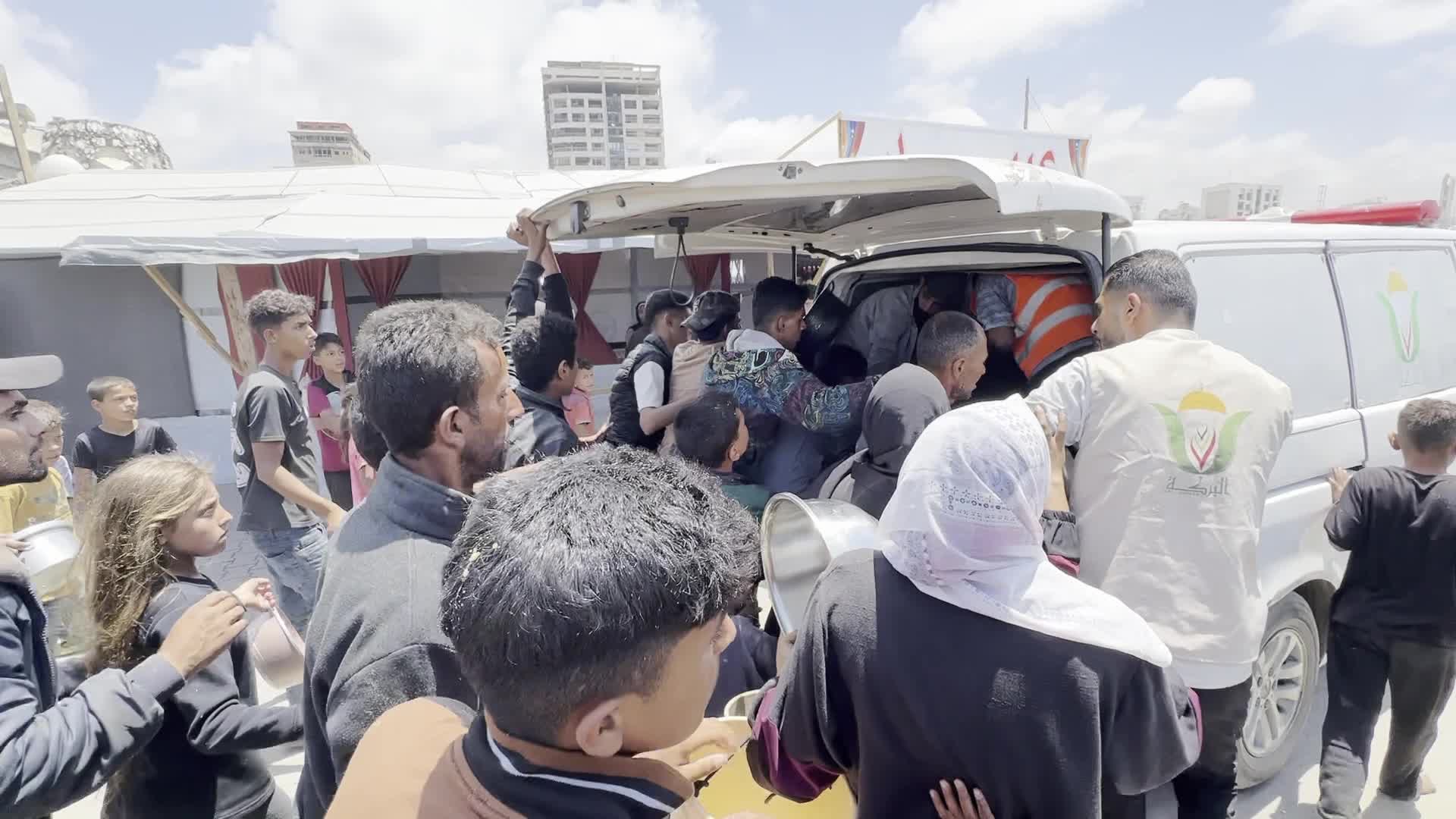 Palestinians Line Up for Hot Meals at Distribution Point in Gaza City