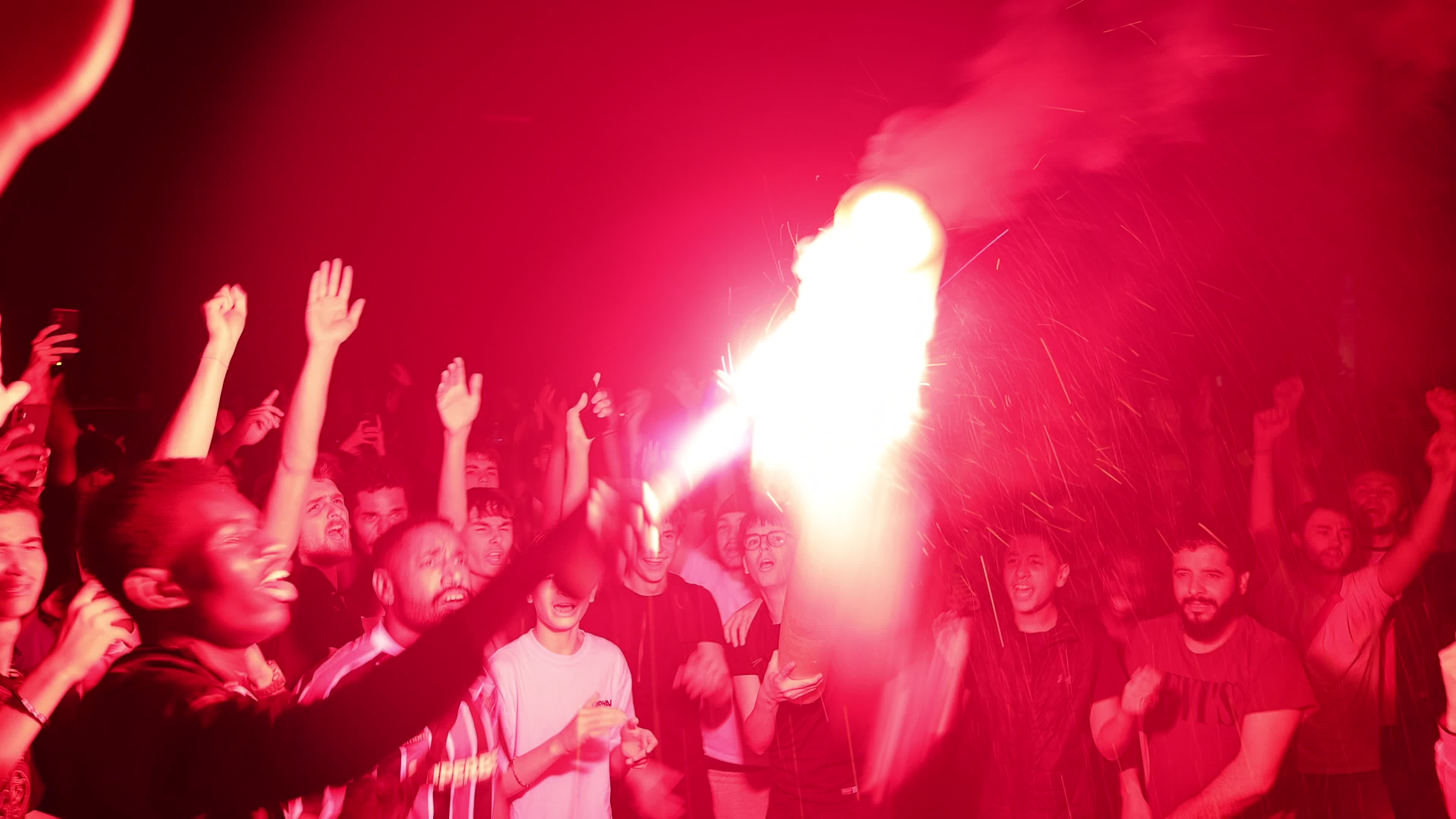 Paris Saint-Germain (PSG) supporters celebrate in the streets of Paris