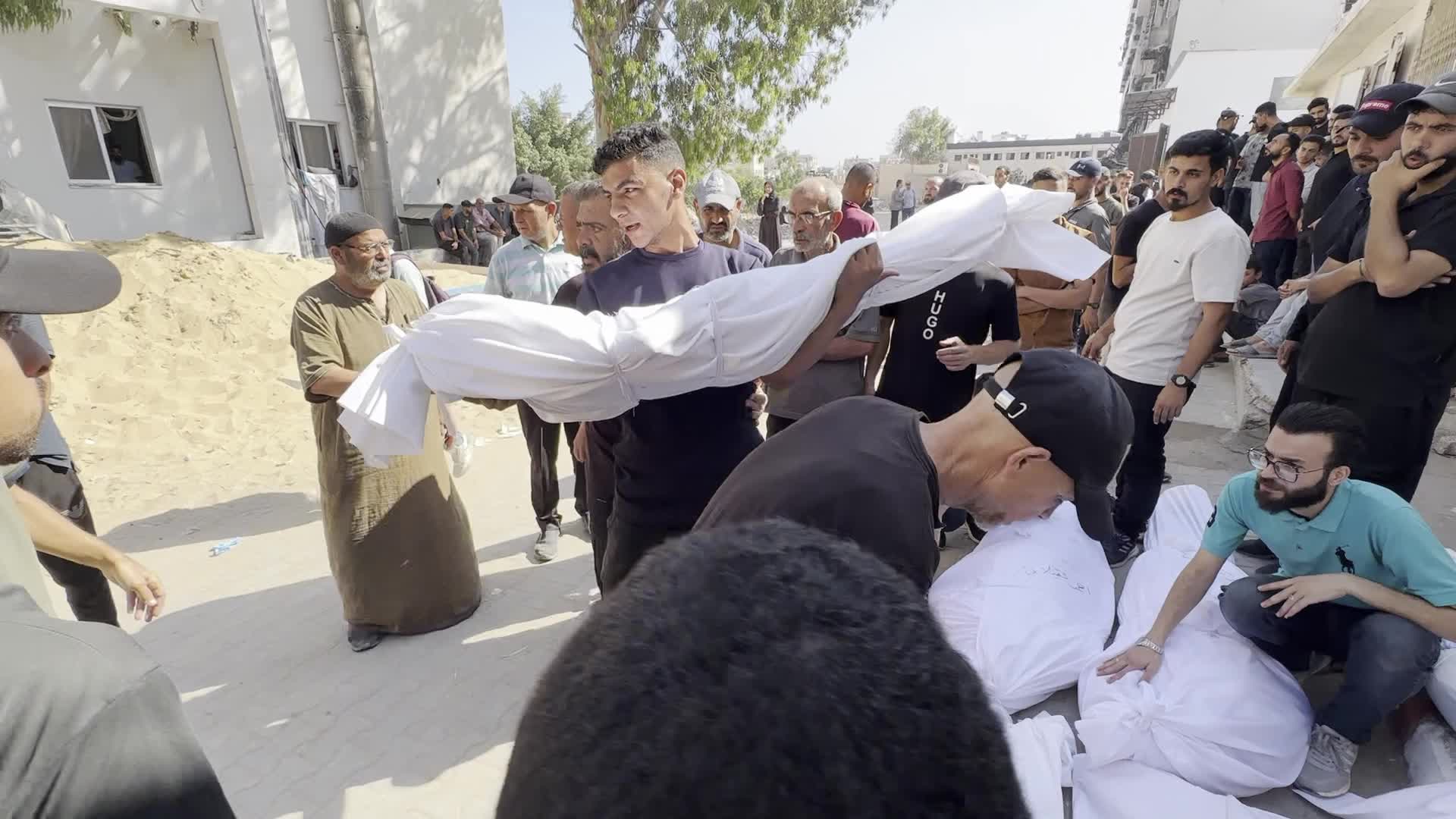  Palestinians Mourn Outside Al-Shifa Hospital After Deadly Israeli Strikes in Gaza City