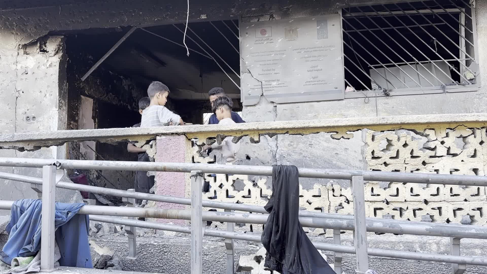 Palestinians Inspect Rubble Near Gaza School After Israeli Strikes