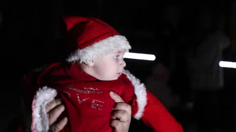 Palestinian Christians attend a Christmas tree lighting celebration