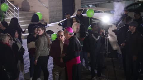 Palestinian Christians attend a Christmas tree lighting celebration