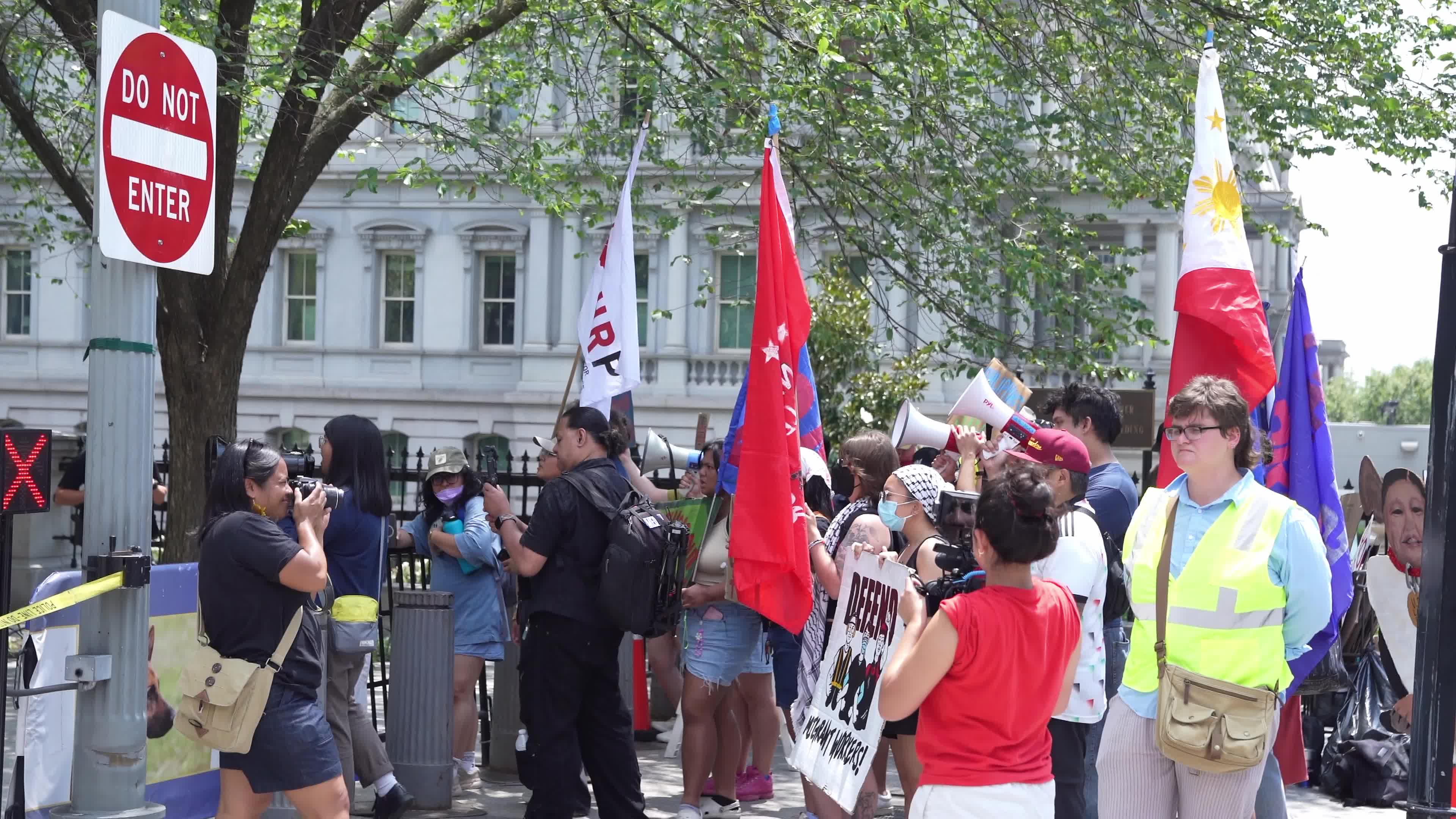 Protesters Gather Outside White House During Trump-Marcos Meeting
