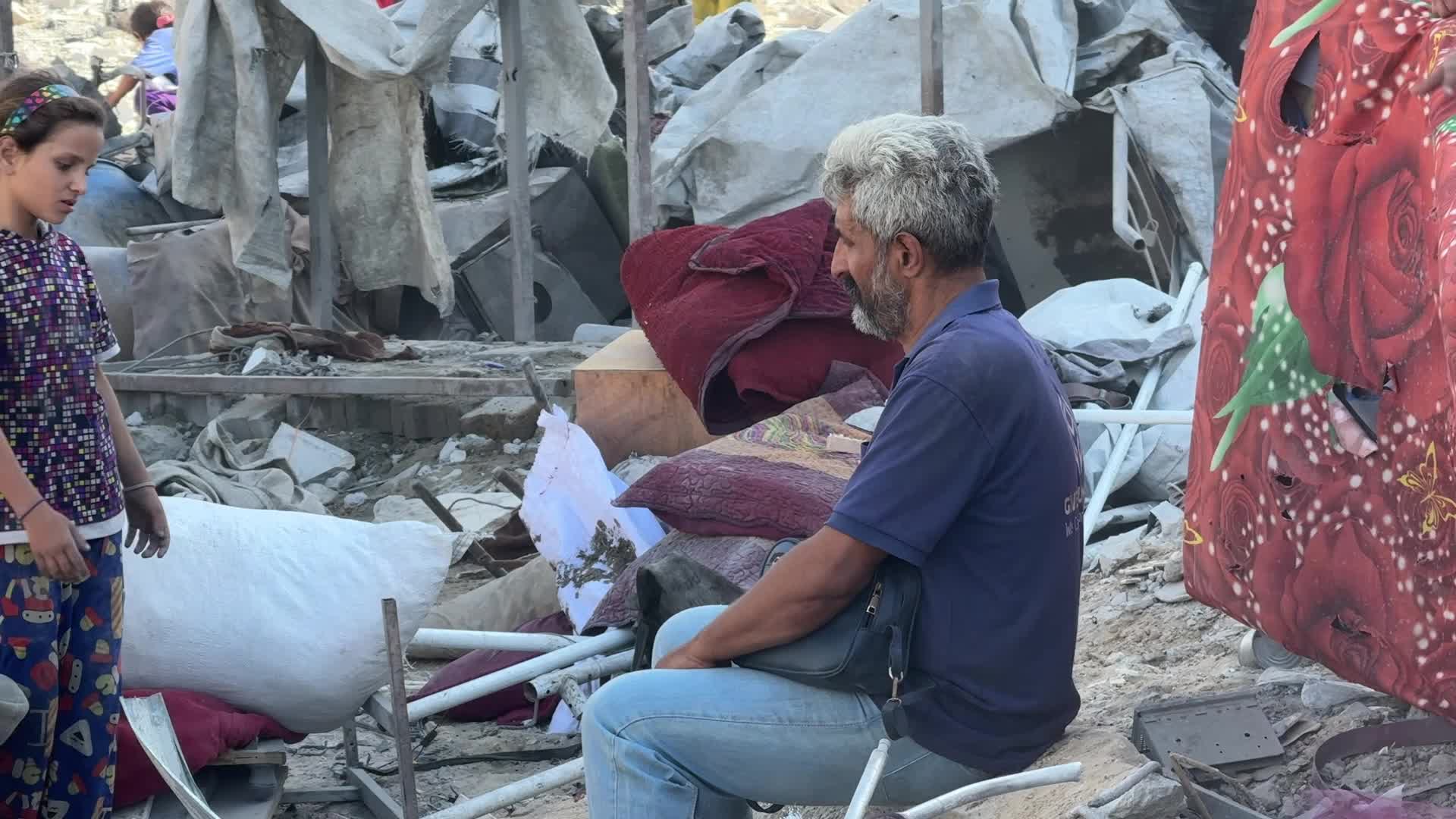 Palestinians Inspect Rubble of al-Ruya Tower After Israeli Strike in Gaza City
