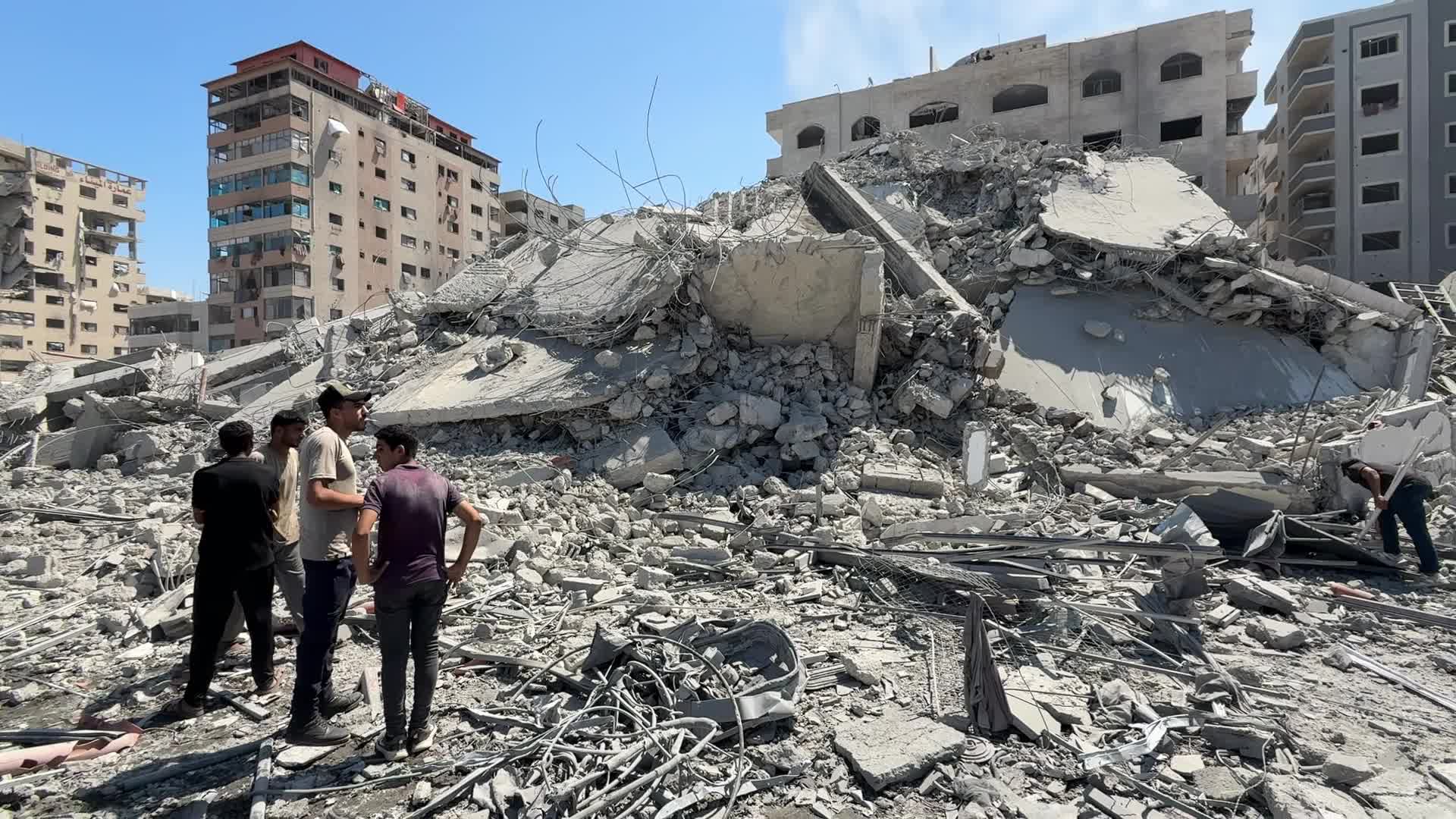 Palestinians Gather at Rubble of Tiba Tower After Israeli Strikes in Gaza City