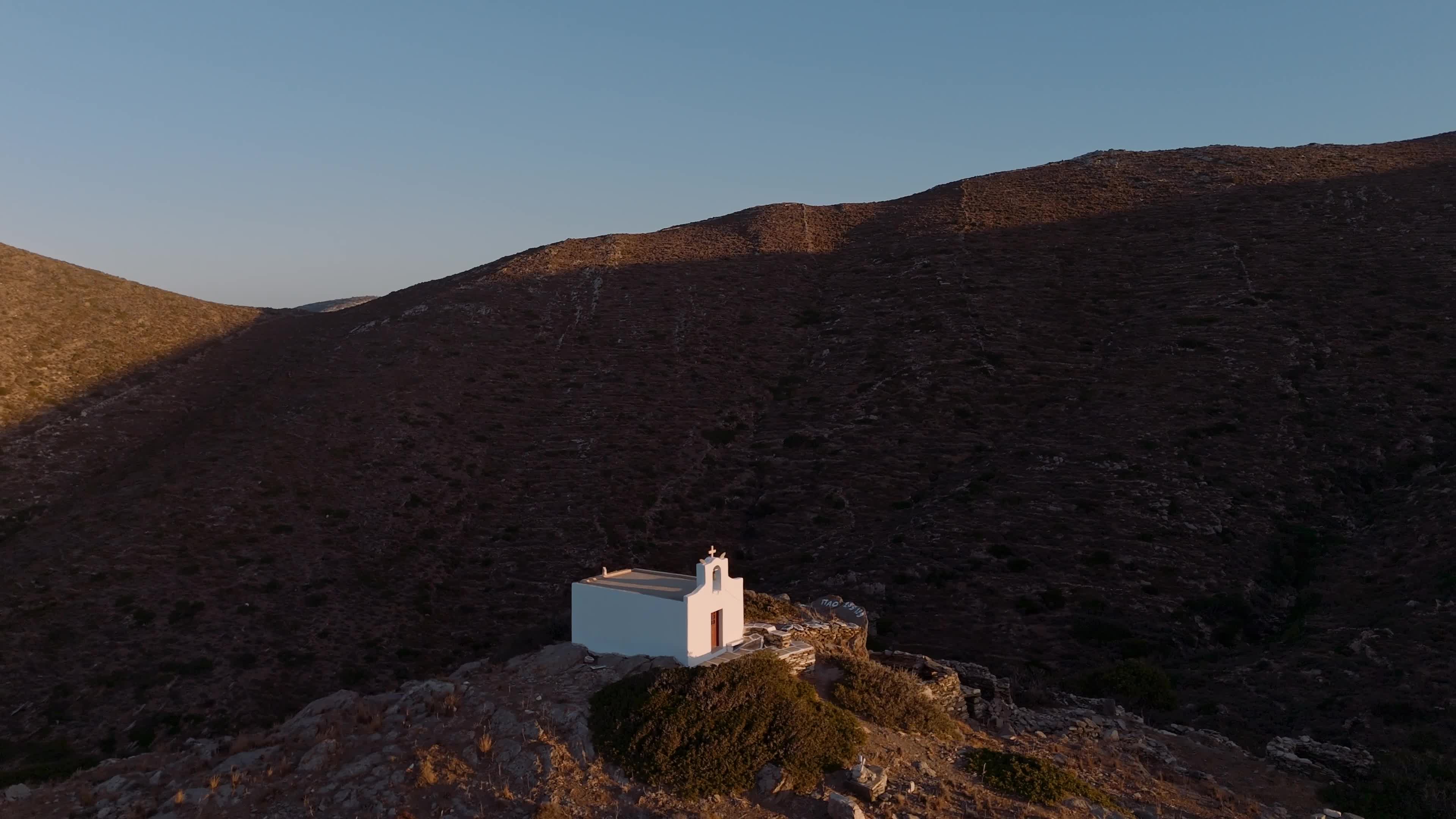 Aerial View of Chapel At Sunset In Ios Island