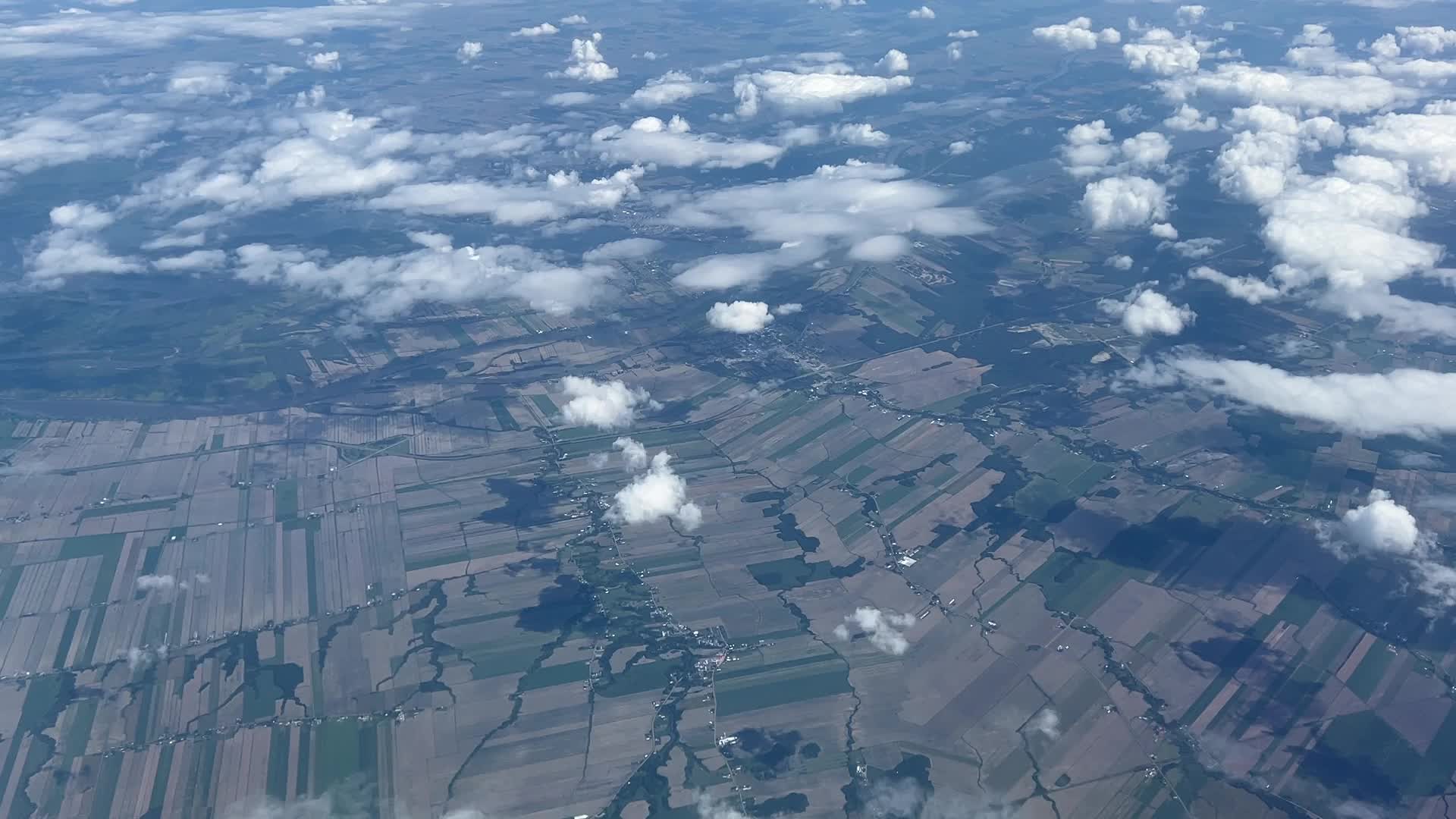 Elevated view above the clouds flying over Quebec, Canada