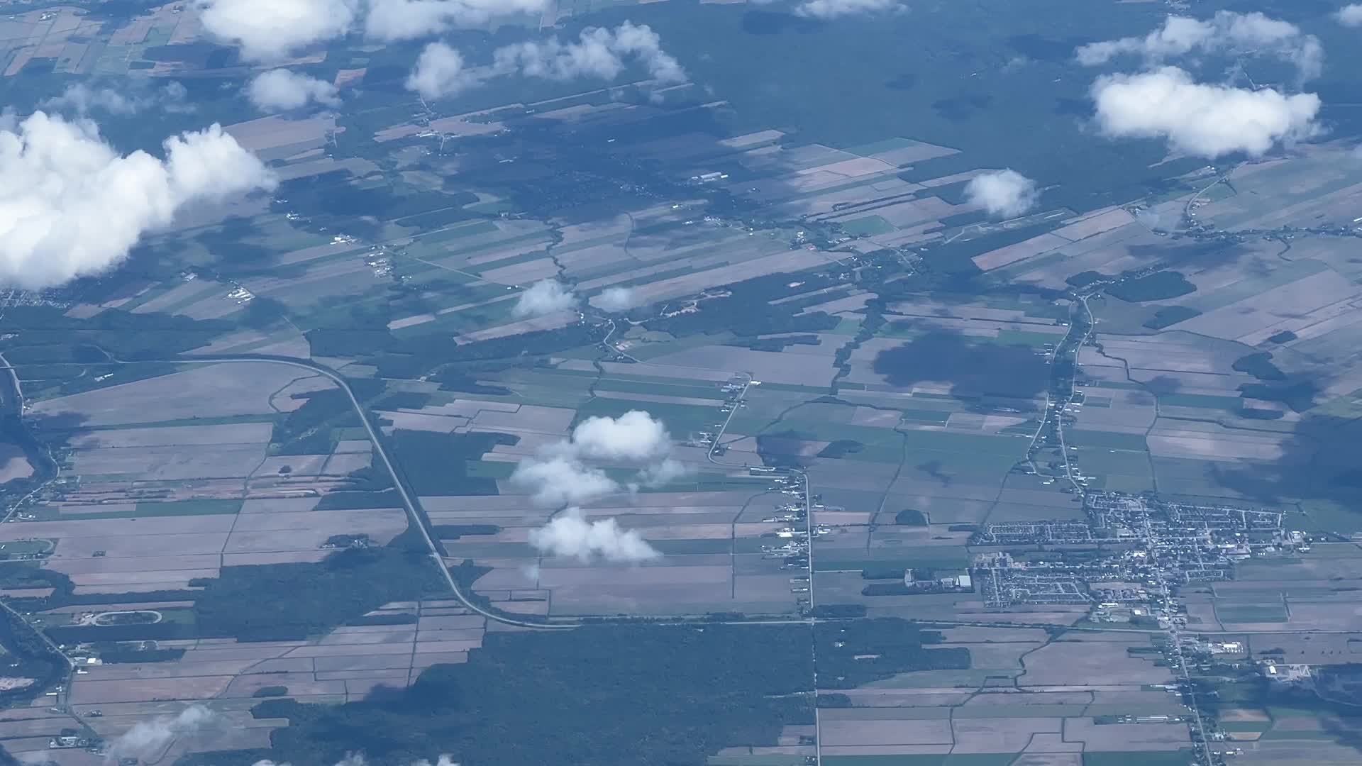 Elevated view above the clouds flying over Quebec, Canada