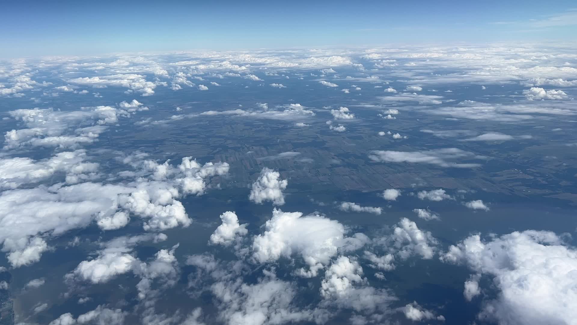 Elevated view above the clouds flying over Quebec, Canada
