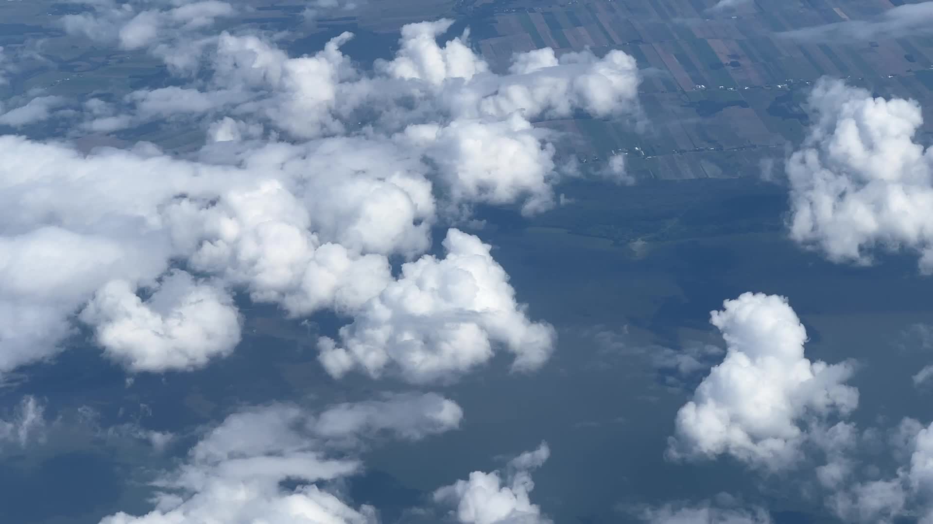Elevated view above the clouds flying over Quebec, Canada