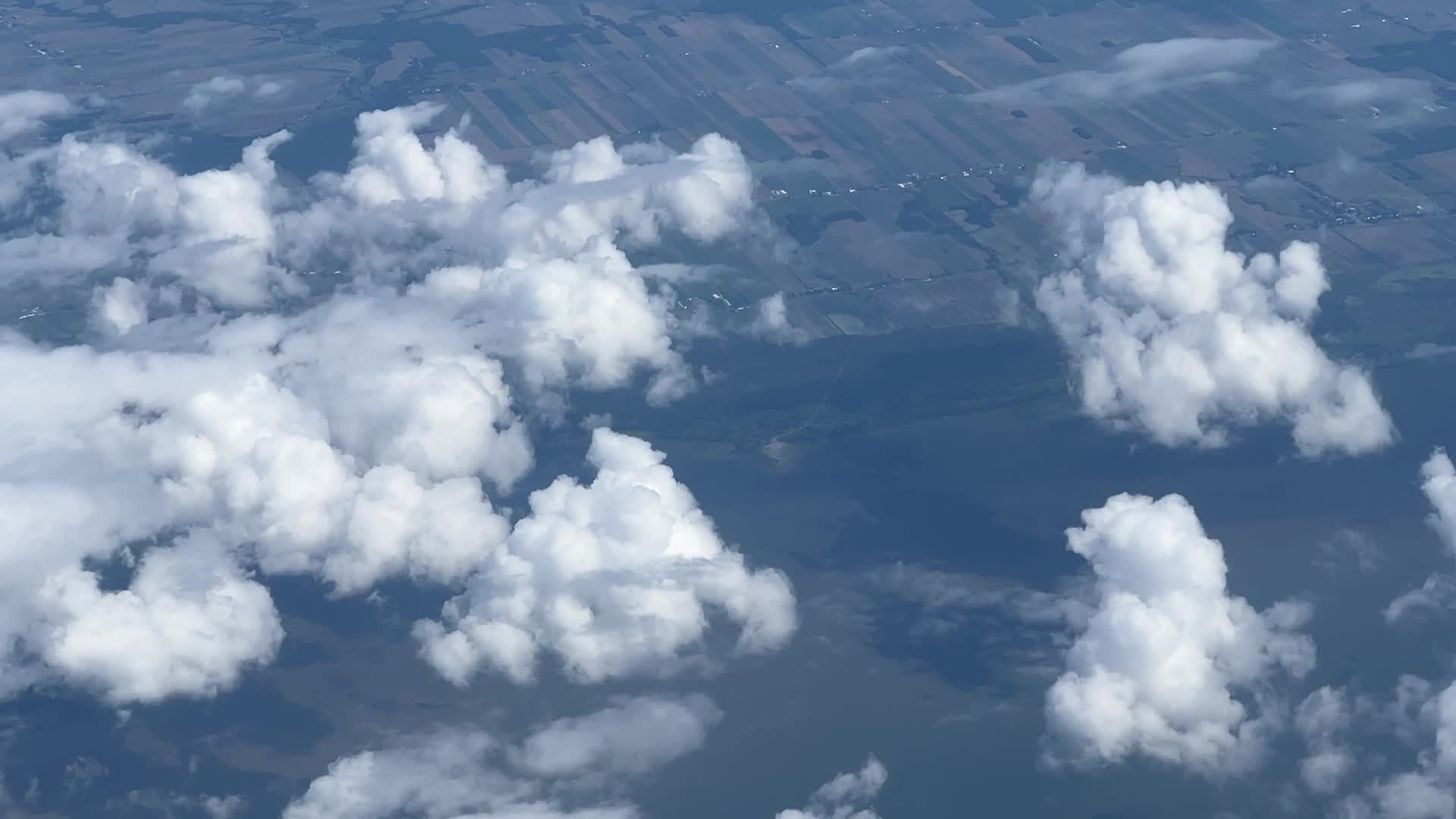 Elevated view above the clouds flying over Quebec, Canada