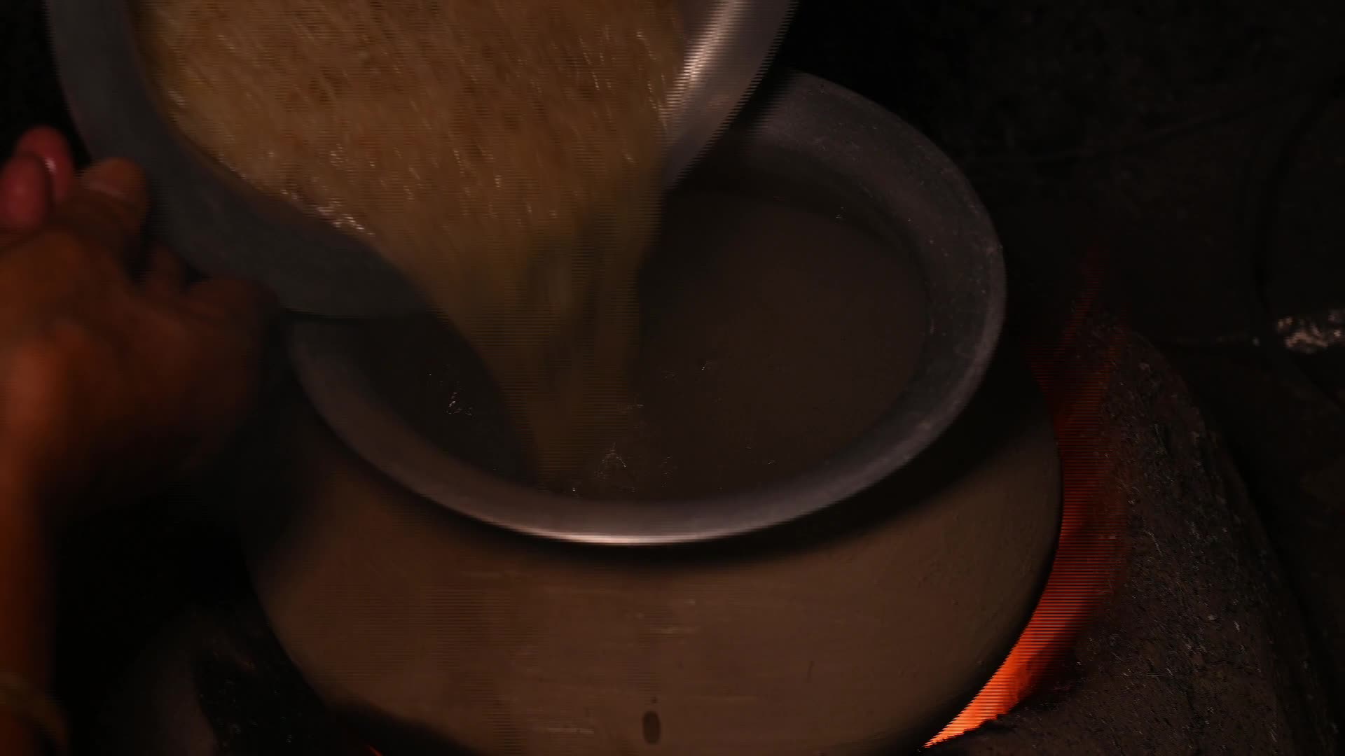Cooking in an Old-fashioned wood-fired mud stove in India  - 12/05/2025