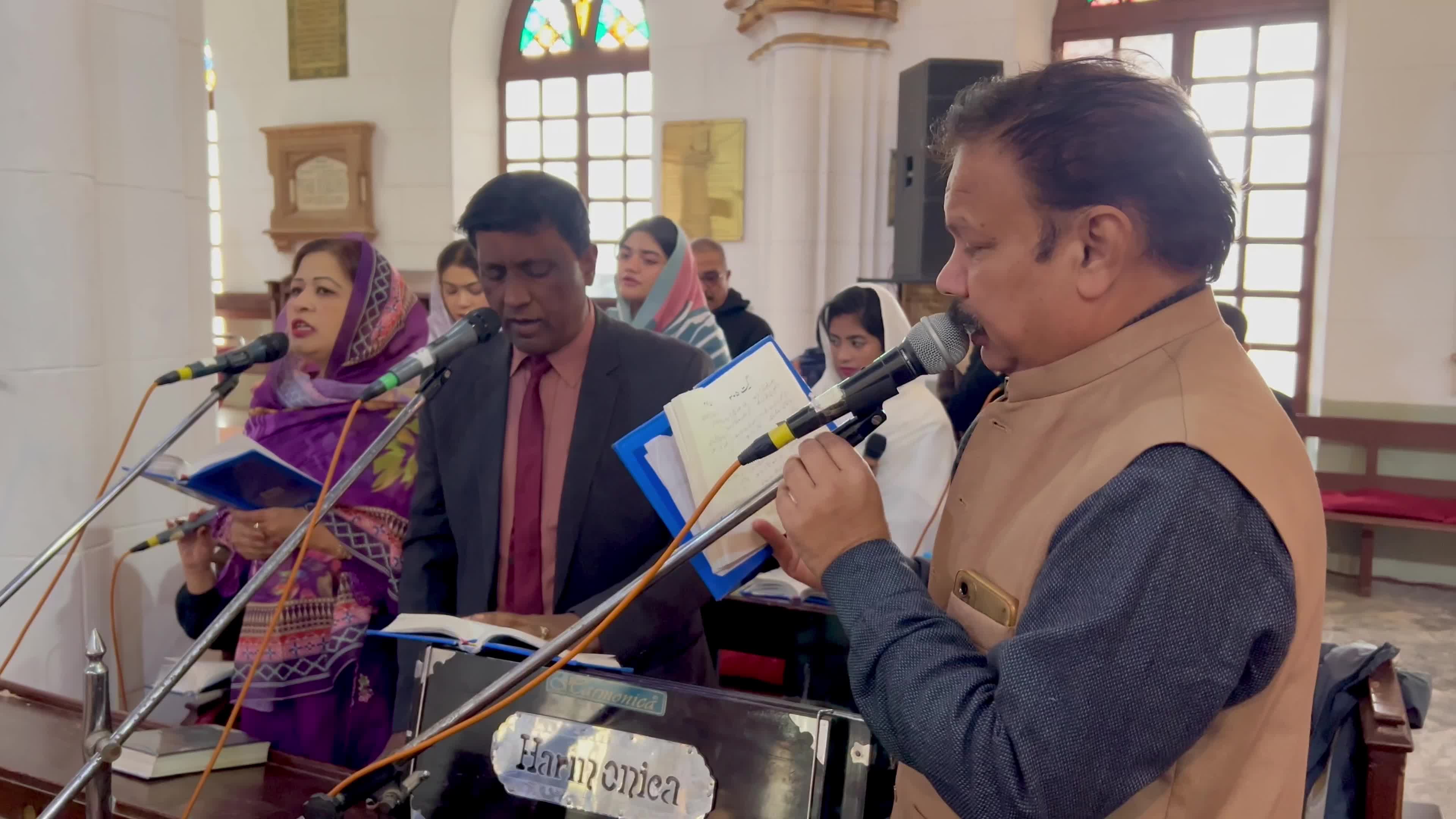 People pray as they attend a New Year service at the St. John's Cathedral in Peshawar 