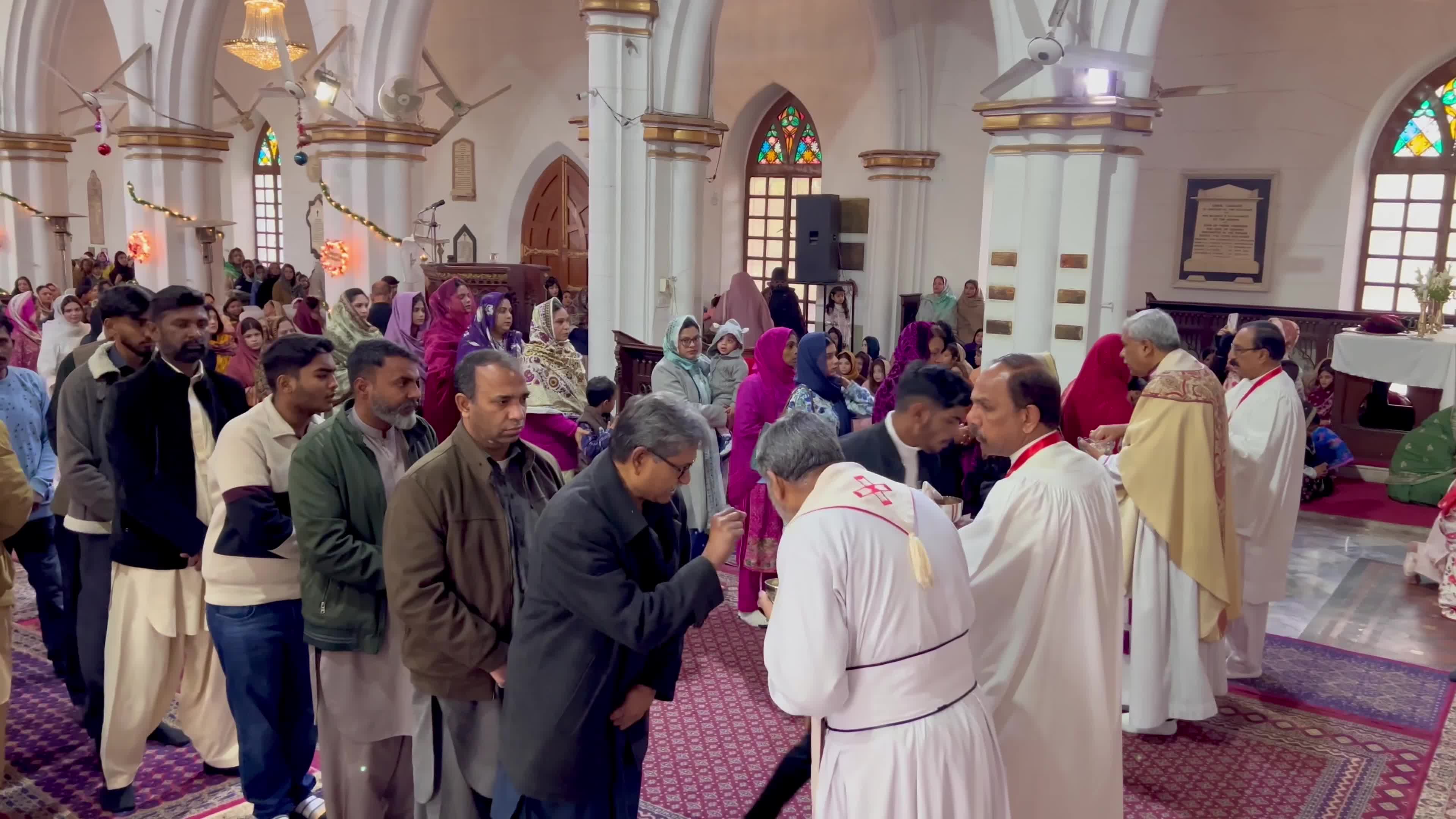 People pray as they attend a New Year service at the St. John's Cathedral in Peshawar 