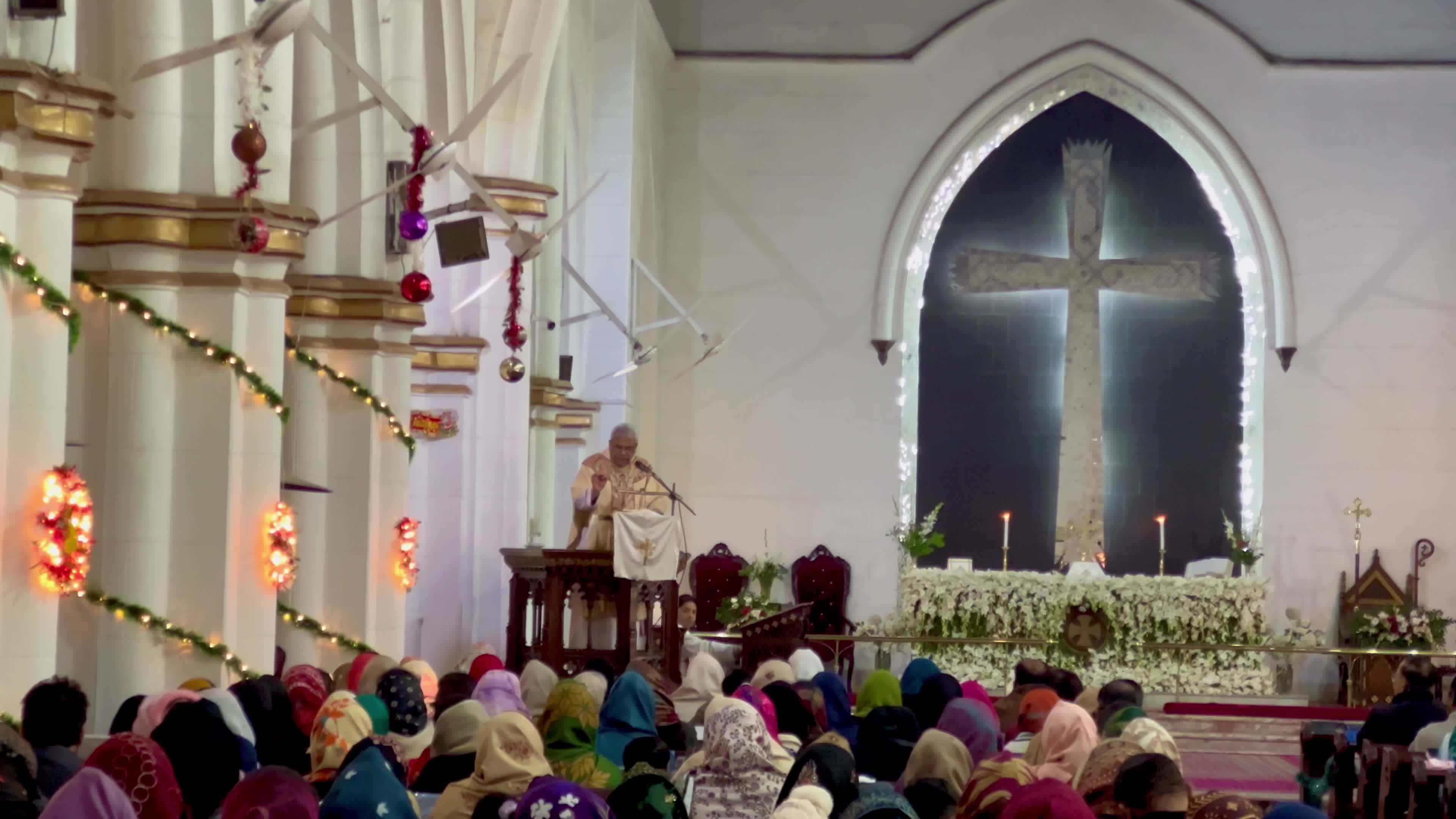 People pray as they attend a New Year service at the St. John's Cathedral in Peshawar 