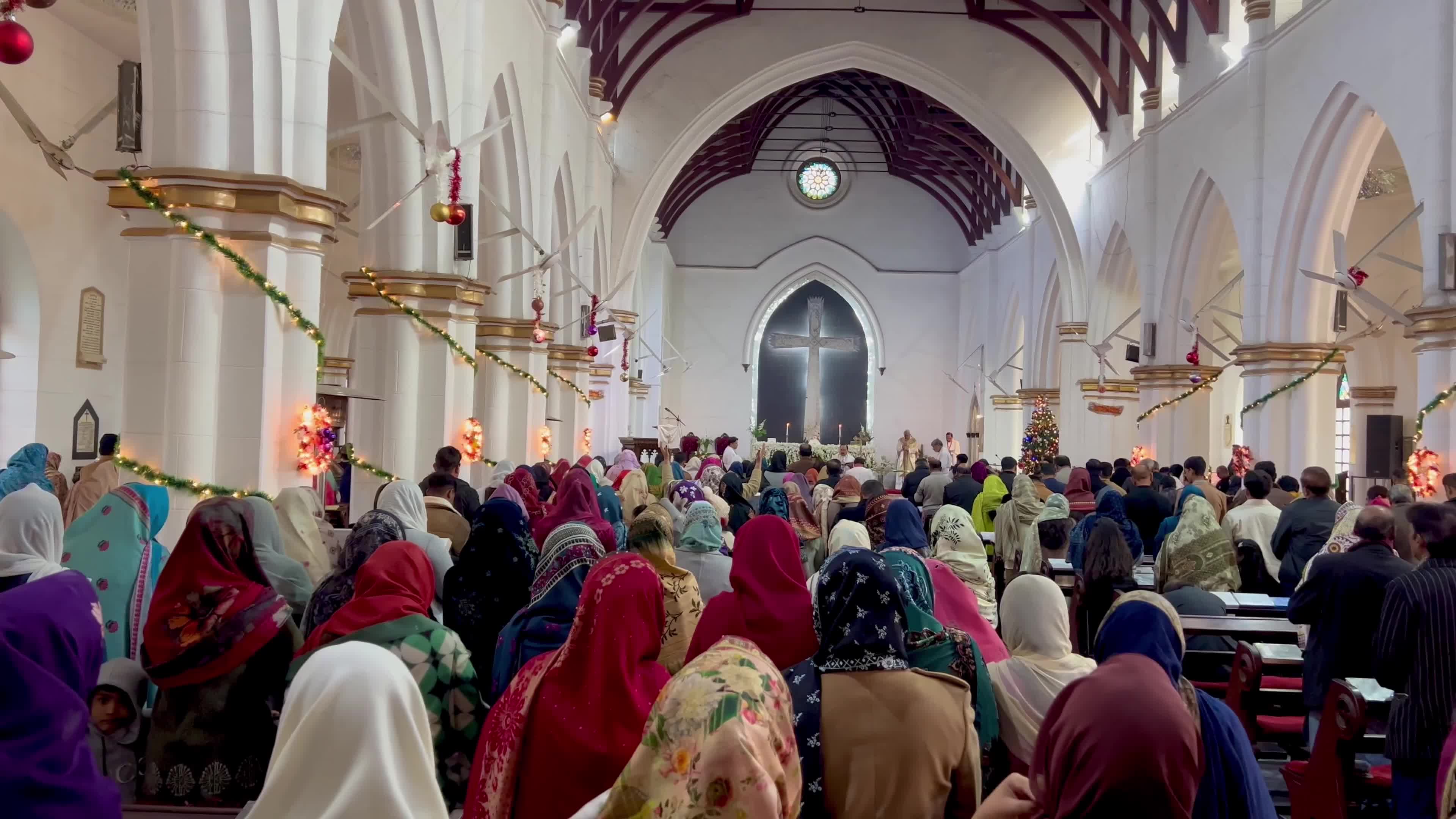 People pray as they attend a New Year service at the St. John's Cathedral in Peshawar 