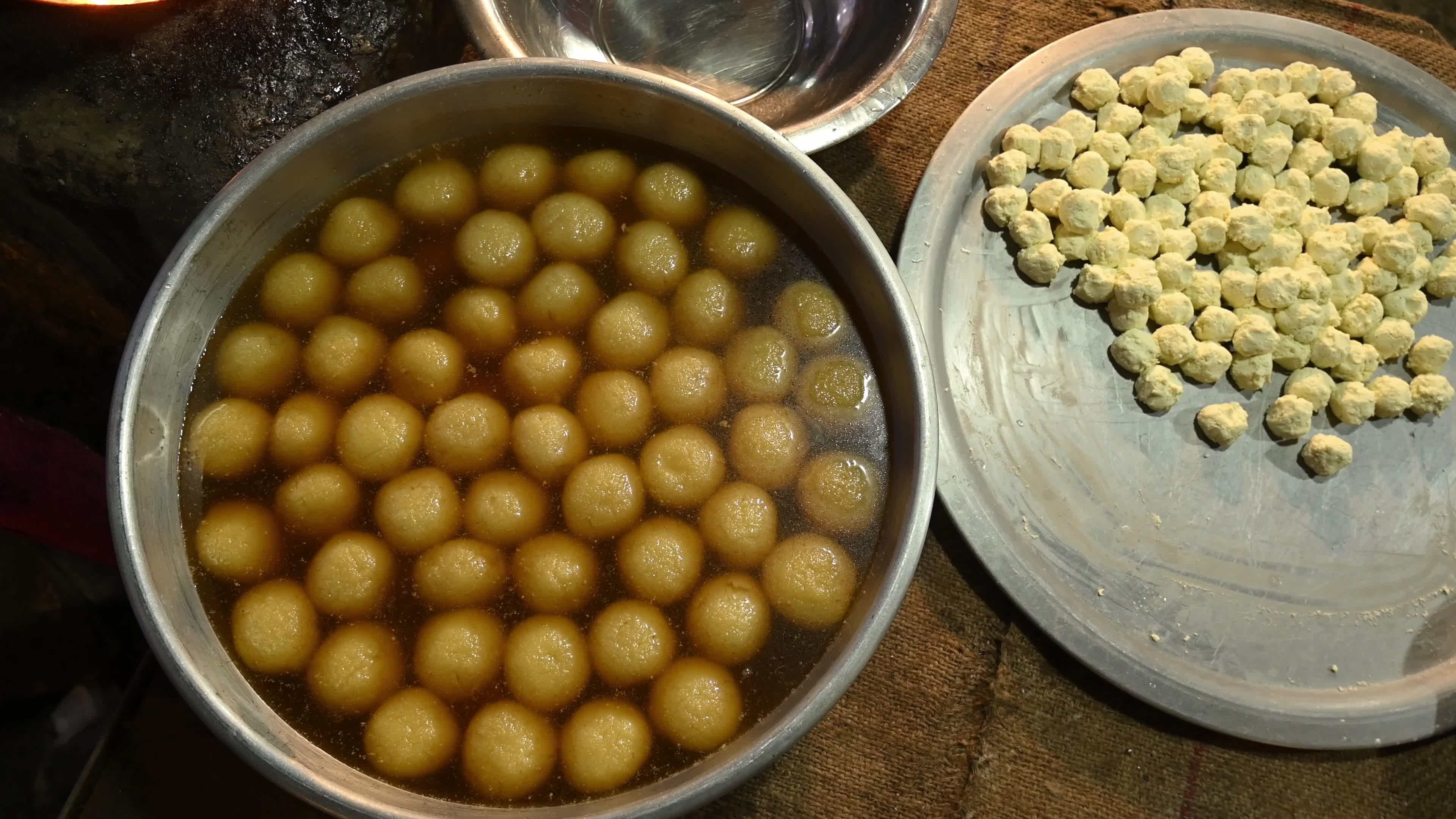 Rosogolla Making at the village fair - Indian sweets (mithai)