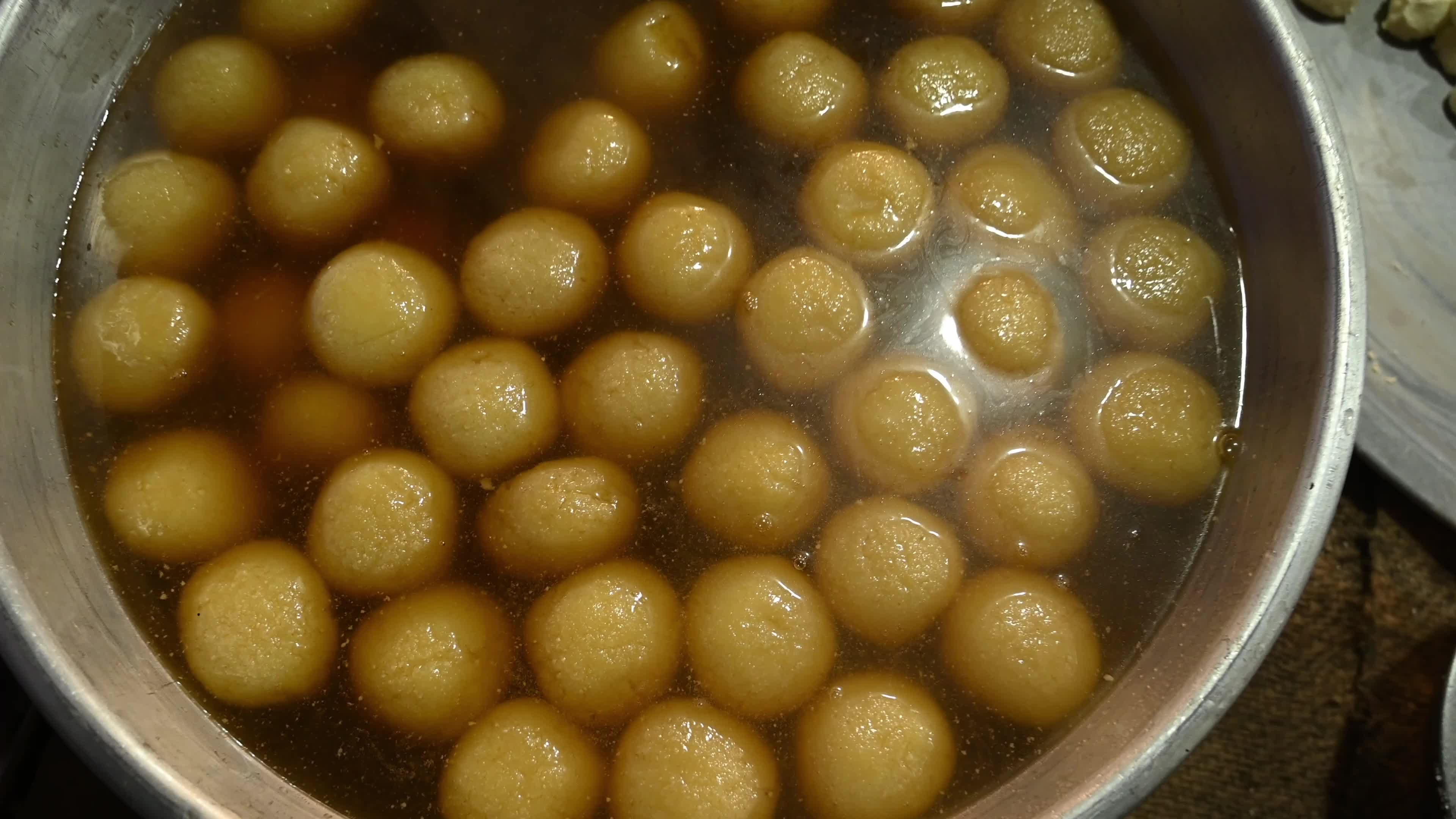 Rosogolla Making at the village fair - Indian sweets (mithai)