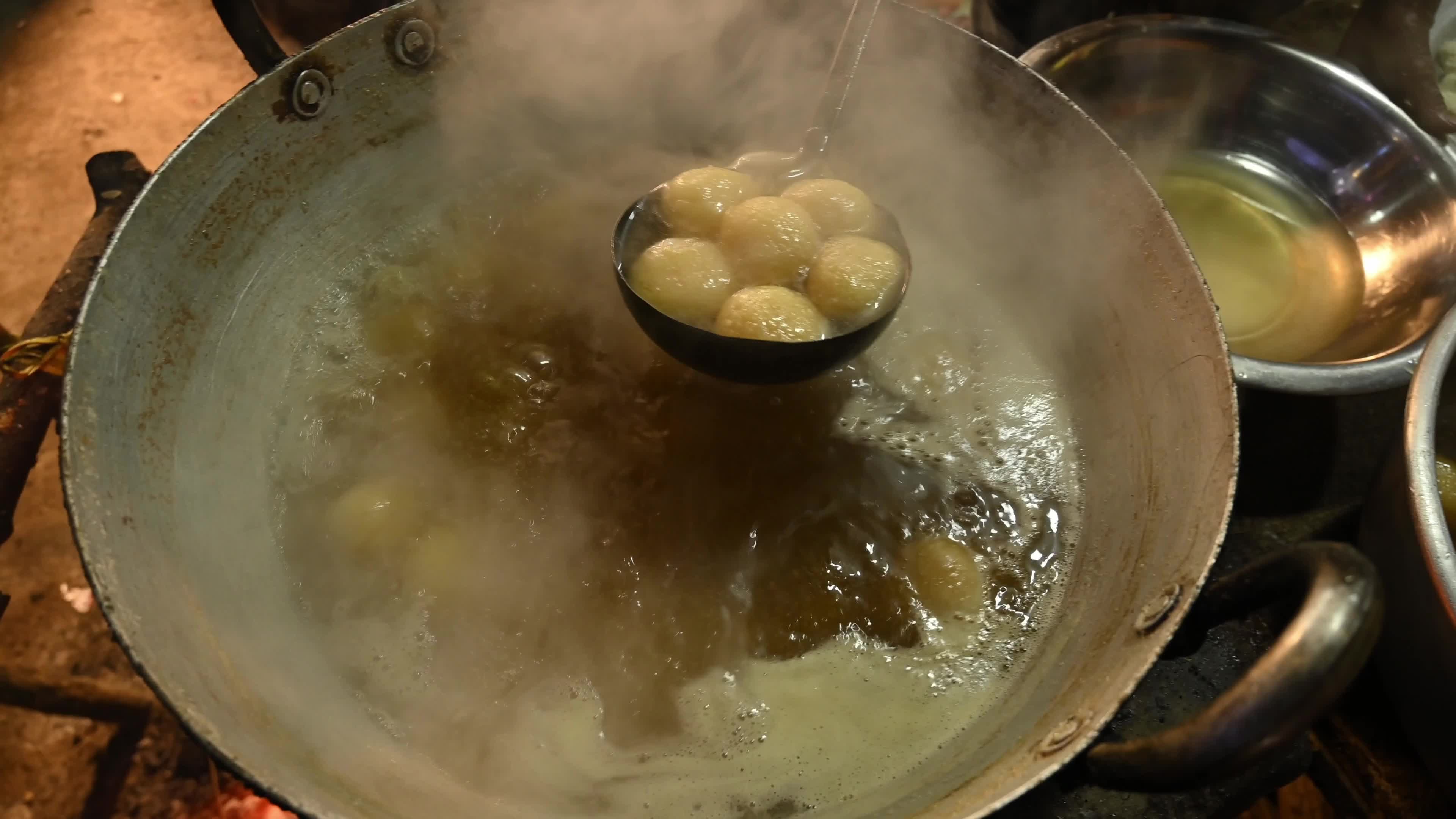Rosogolla Making at the village fair - Indian sweets (mithai)