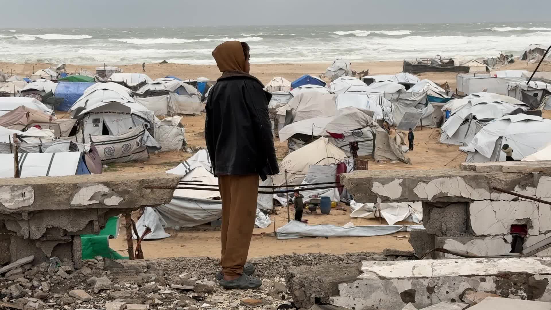 Tent Shelters Line Gaza City Shore Amid Winter Winds