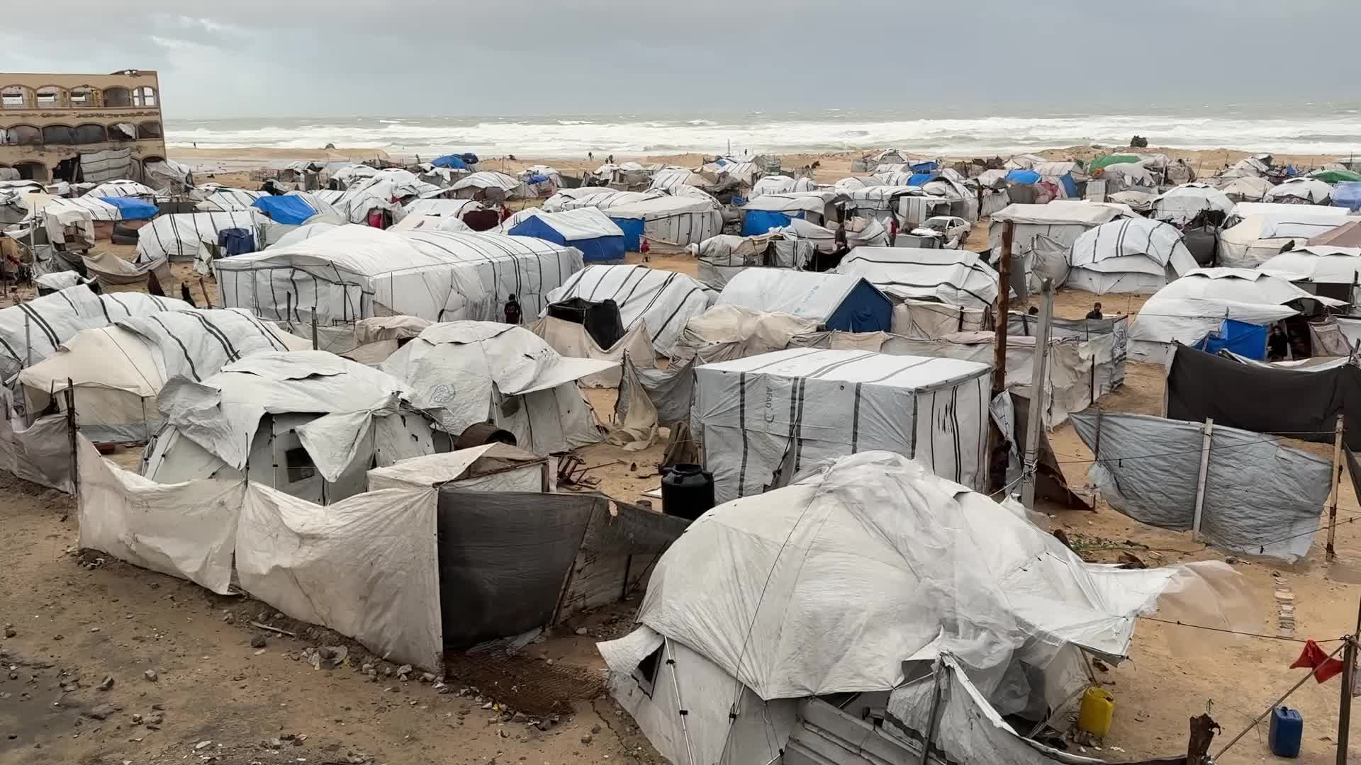 Tent Shelters Line Gaza City Shore Amid Winter Winds