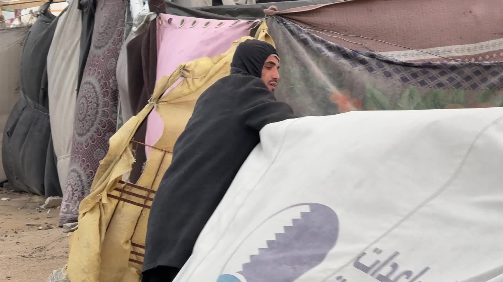 Tent Shelters Line Gaza City Shore Amid Winter Winds