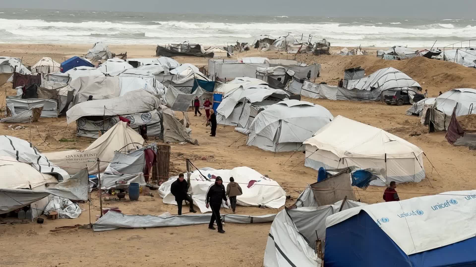 Tent Shelters Line Gaza City Shore Amid Winter Winds