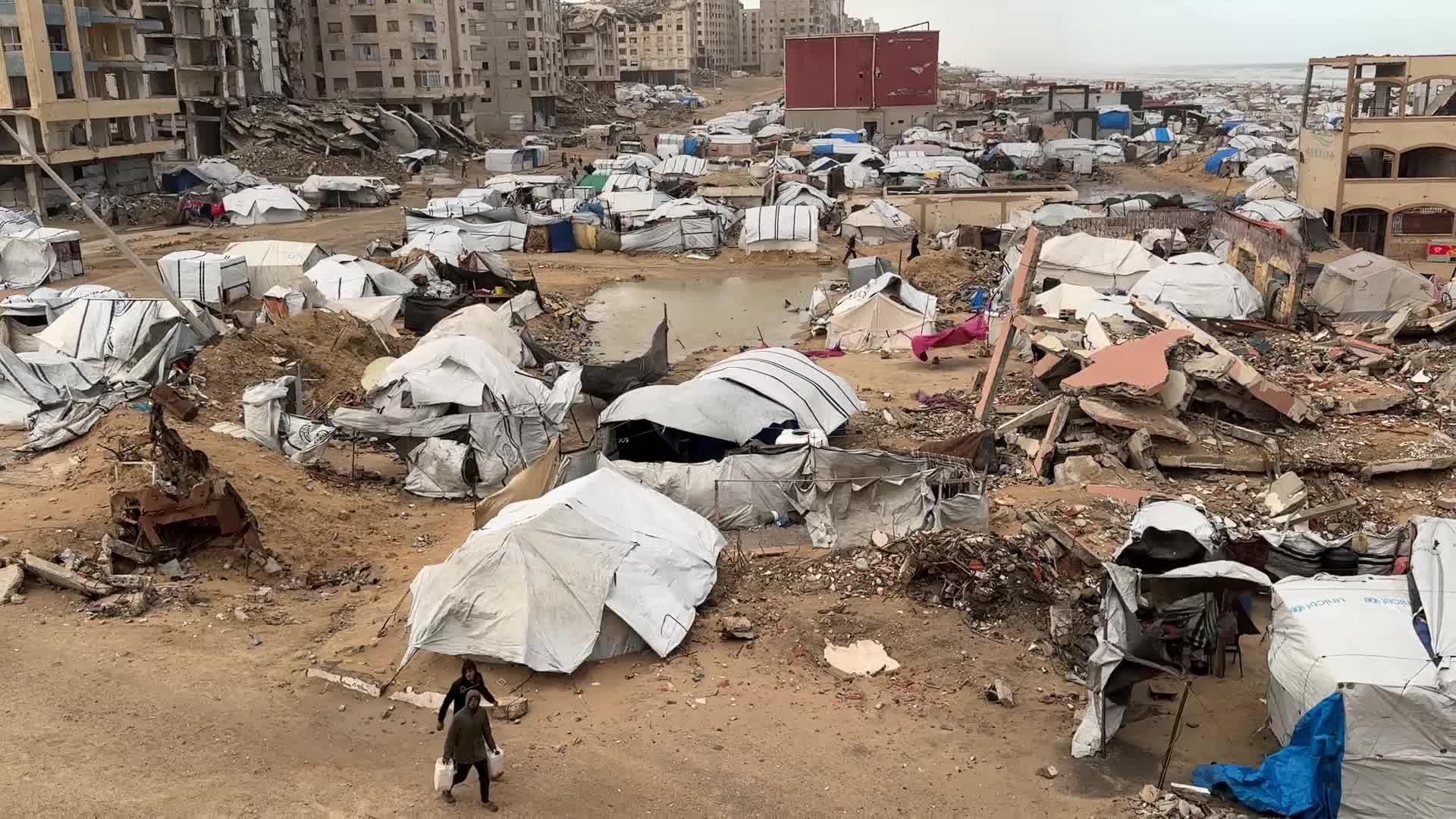 Tent Shelters Line Gaza City Shore Amid Winter Winds