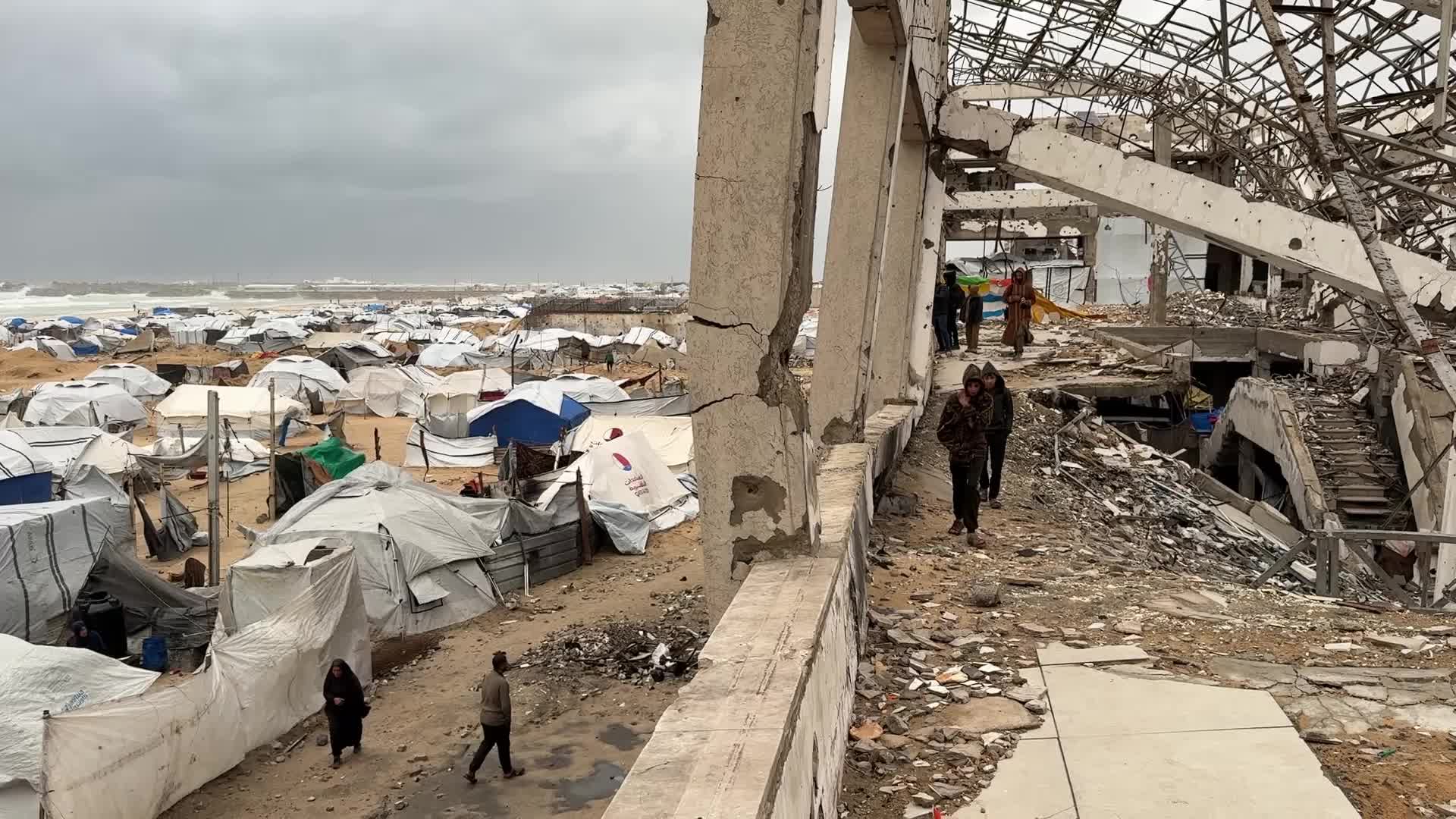 Tent Shelters Line Gaza City Shore Amid Winter Winds