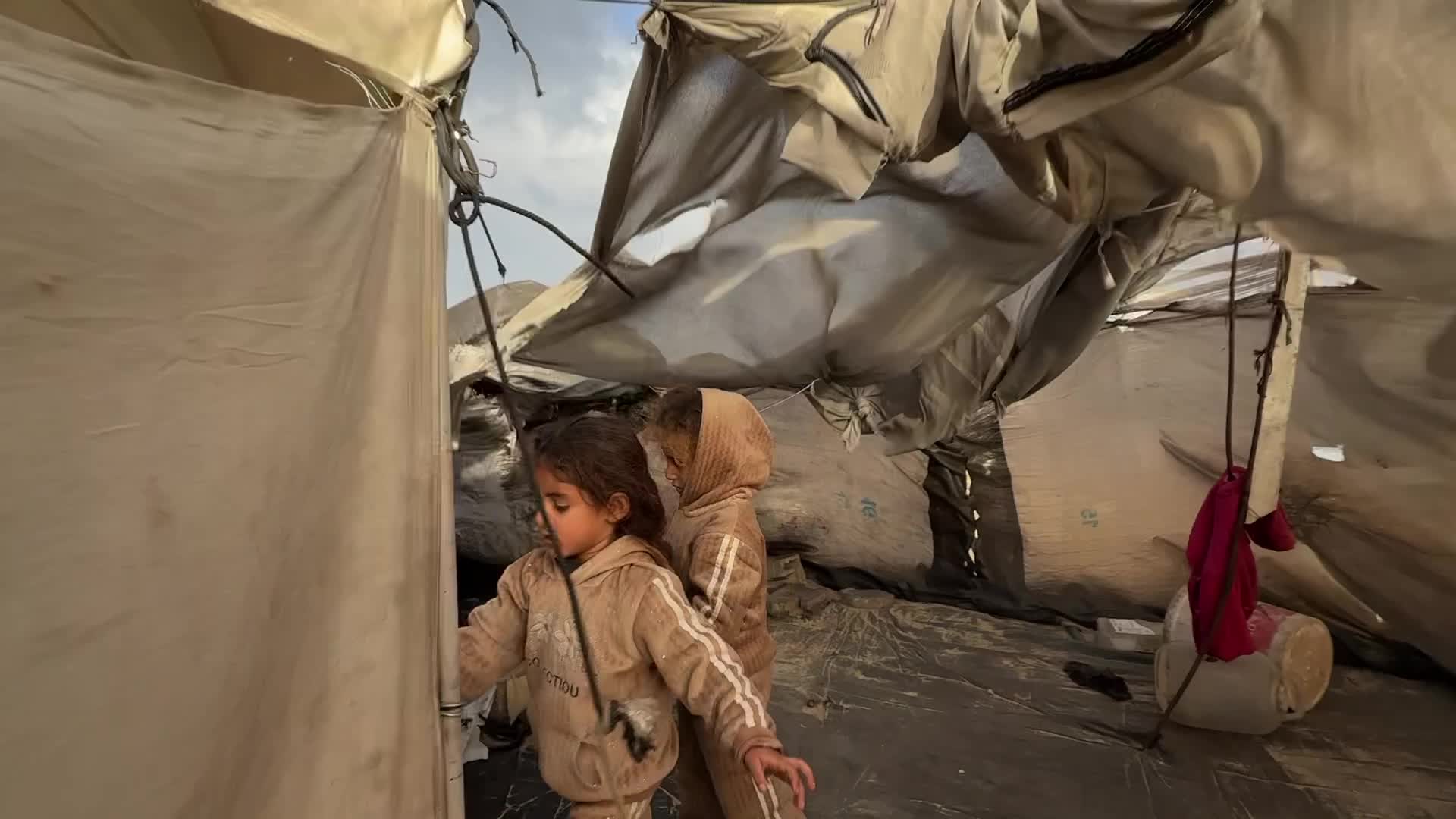 Tent Shelters Line Gaza City Shore Amid Winter Winds
