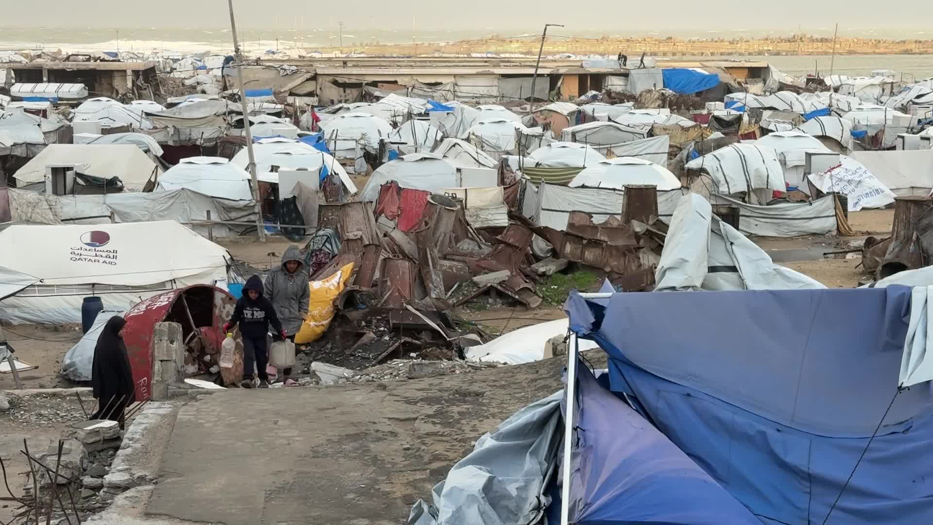 Tent Shelters Line Gaza City Shore Amid Winter Winds