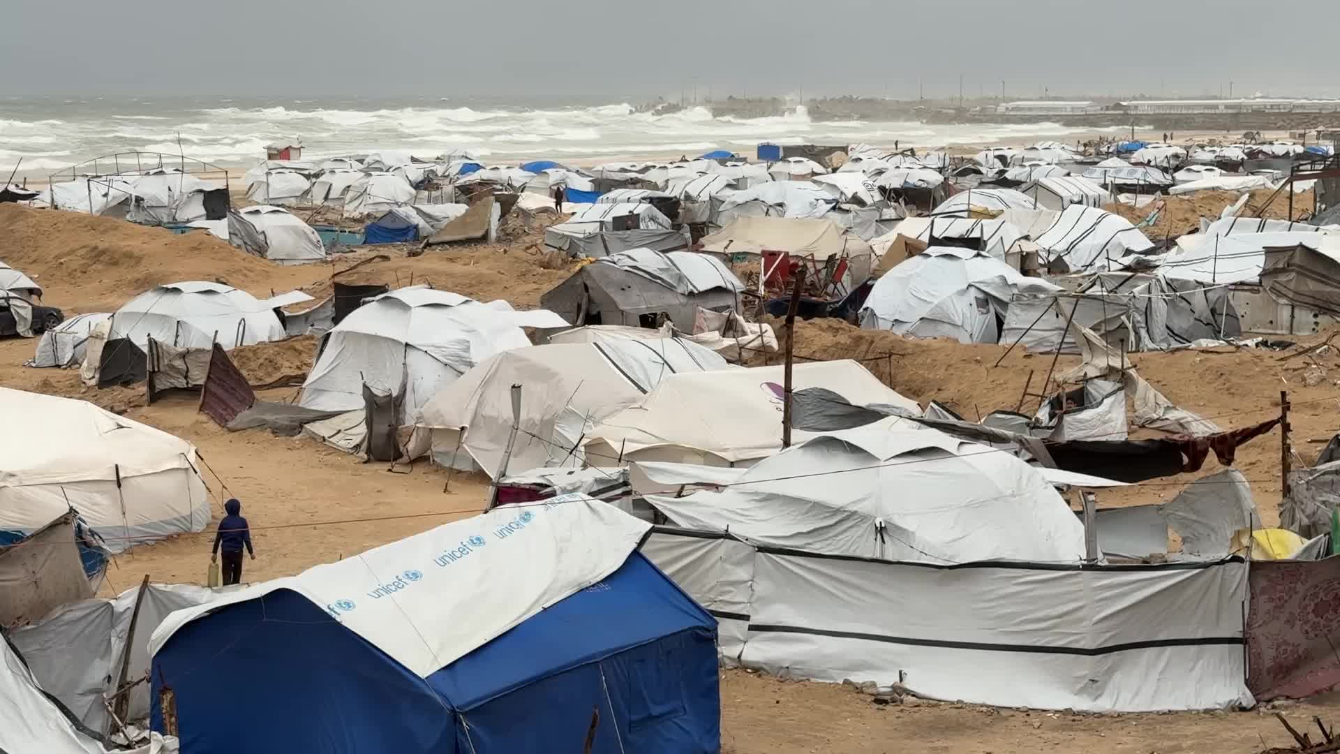 Tent Shelters Line Gaza City Shore Amid Winter Winds