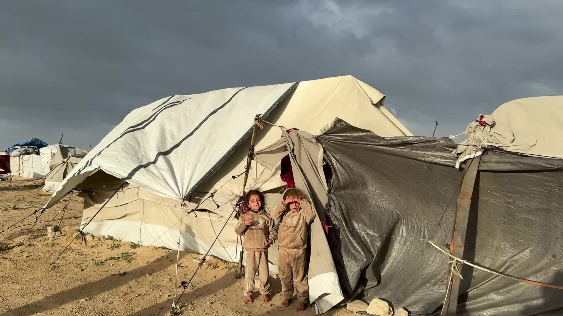 Tent Shelters Line Gaza City Shore Amid Winter Winds