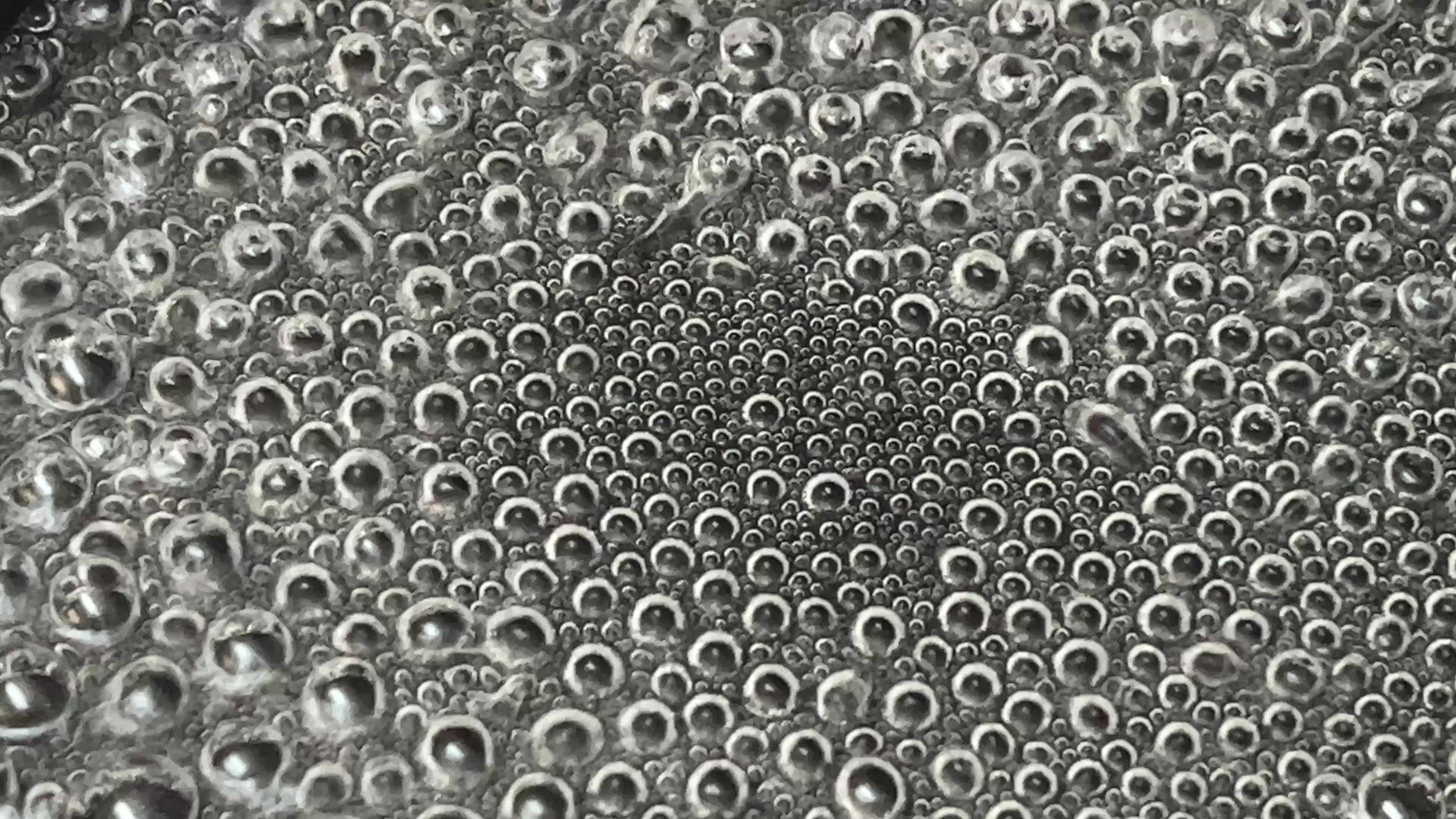 Close-up of water boiling in a pan
