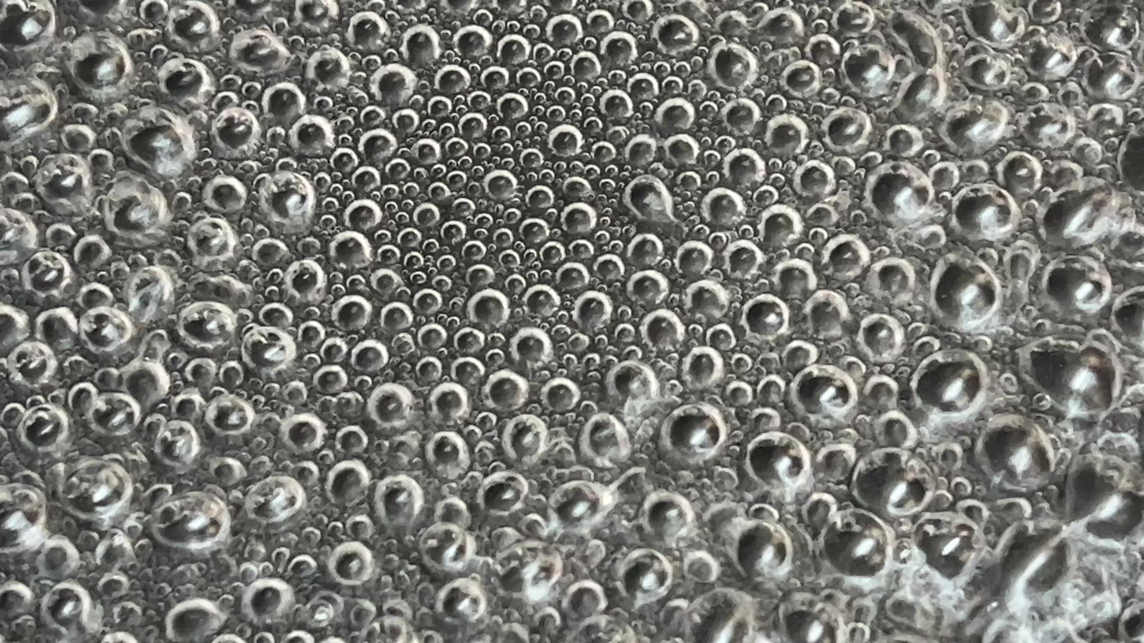 Close-up of water boiling in a pan