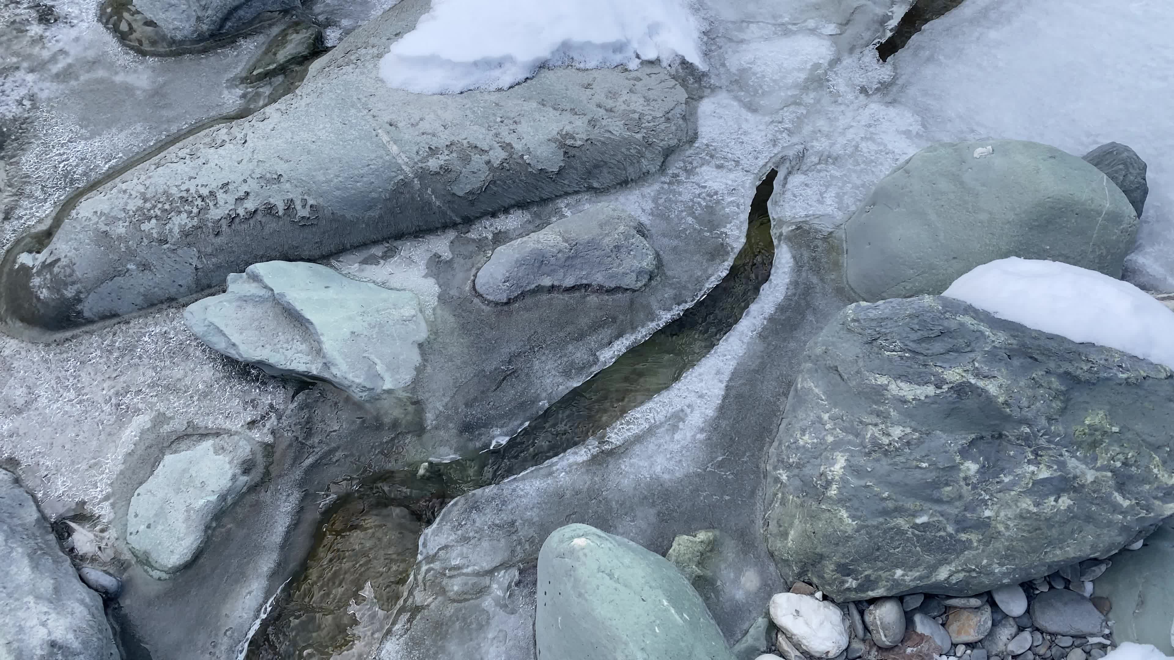 A view of partially frozen river sindh during winter.